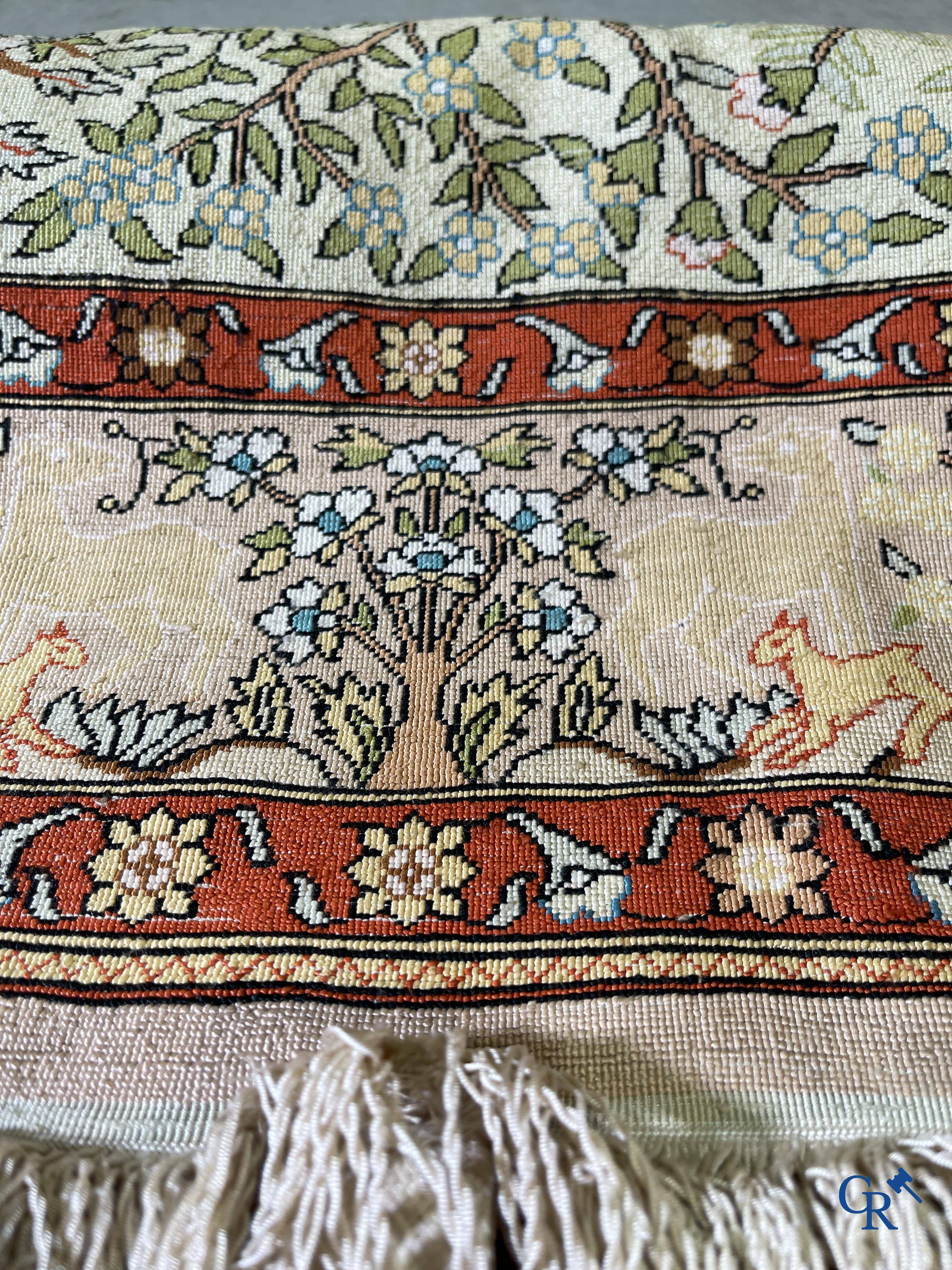 Oriental rugs, a fine hand-knotted silk tapestry with animals in a forest. Signed.