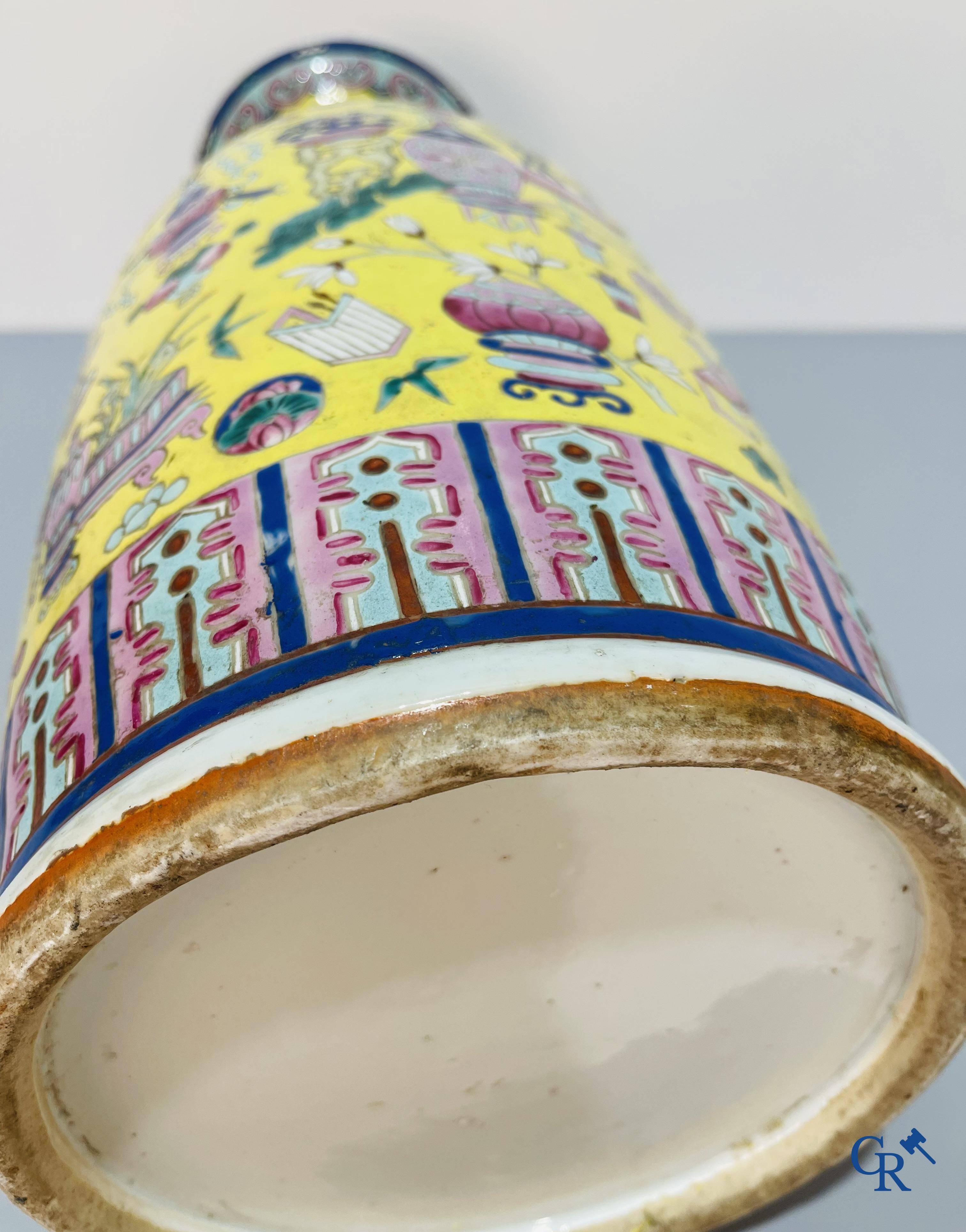 Asian Art, Chinese porcelain, a large Chinese famille jaune and rose vase with a decor of antiques. 19th century.