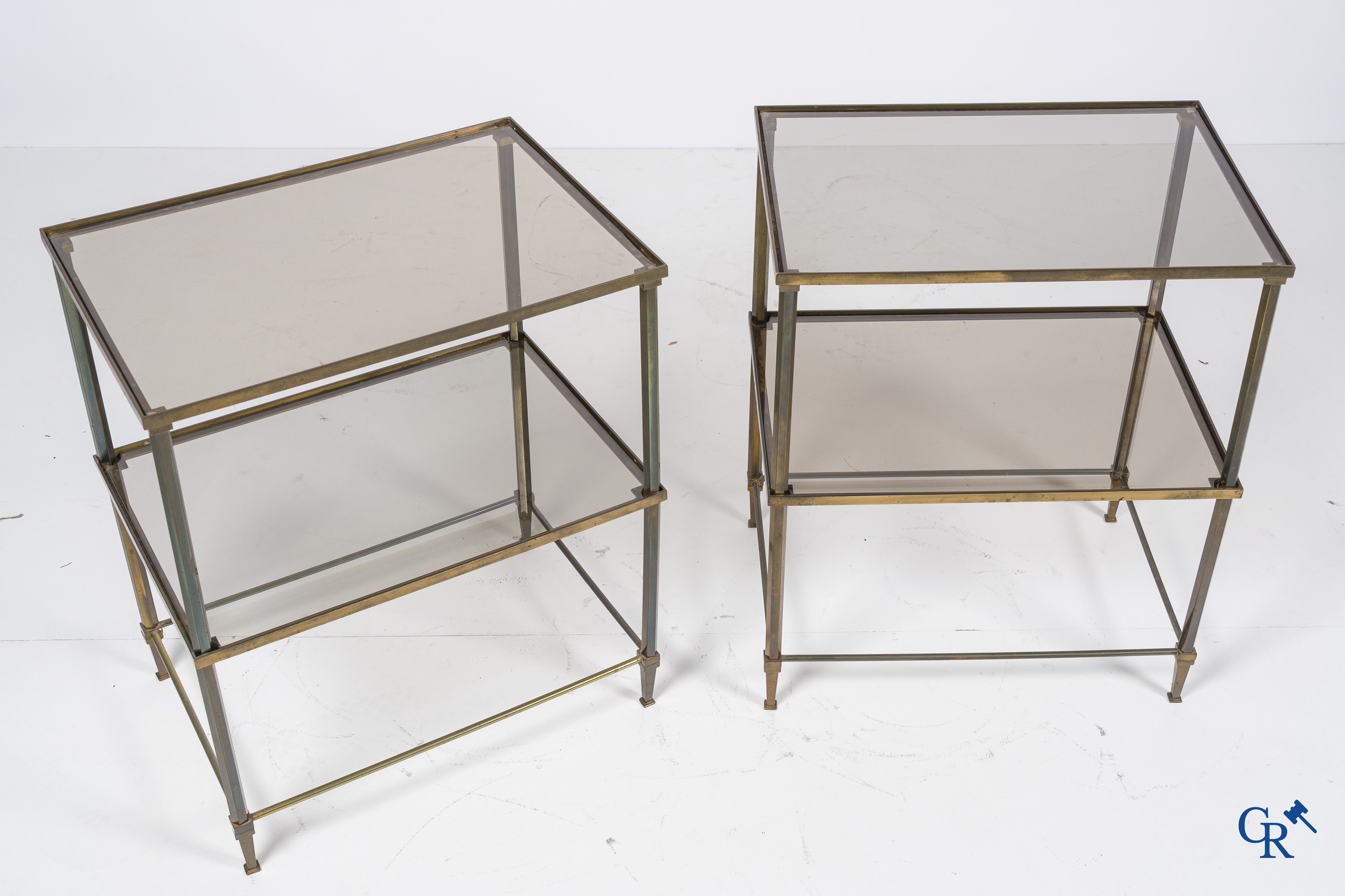 A pair of side tables in bronze and glass. Around 1960.