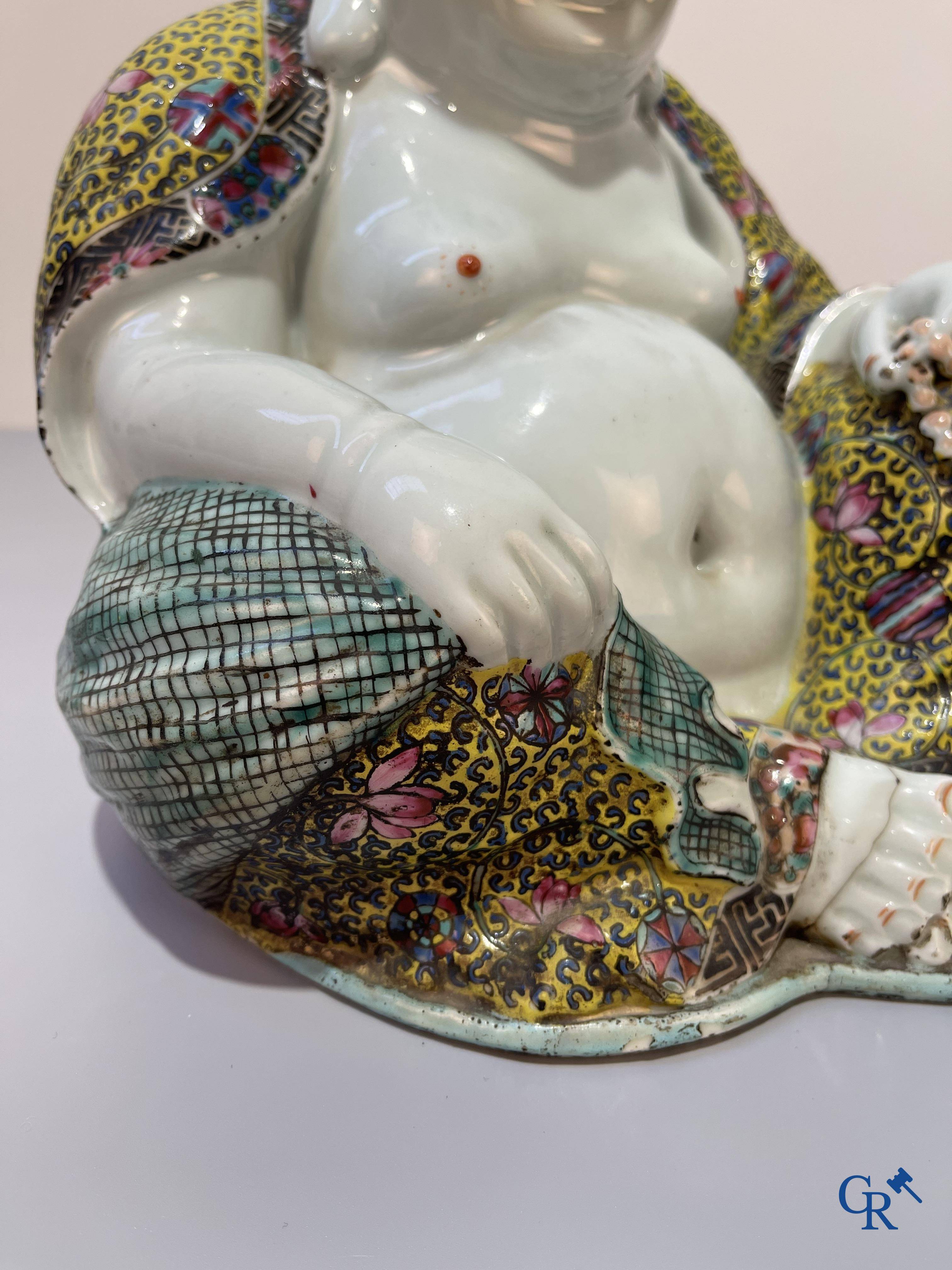 Asian Art, Chinese porcelain. A Chinese famille rose figure of a Buddha with a seal mark. 19th century.