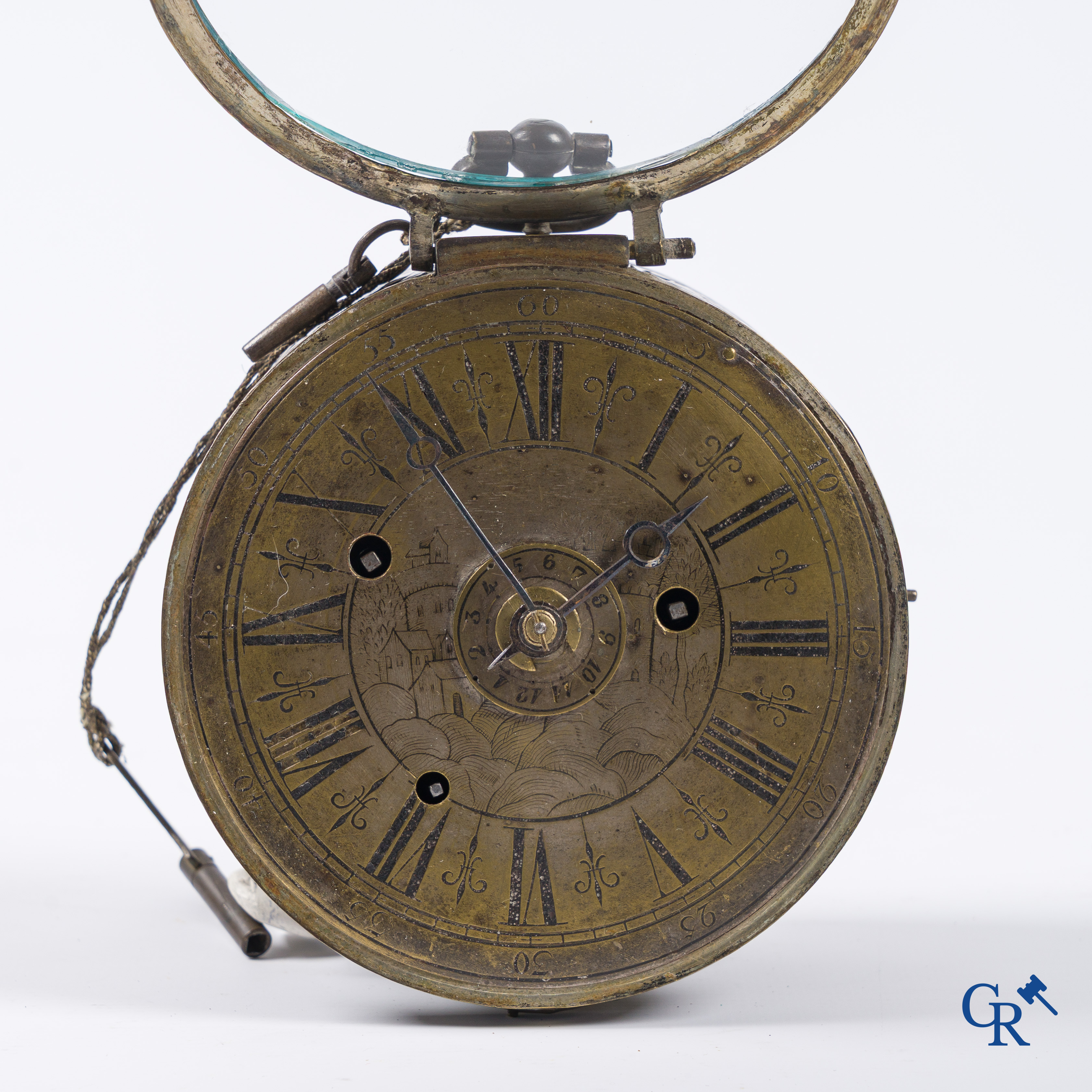 Clocks and watches. Montre de carosse. Large carriage watch with engraved and perforated case. France 17th century.