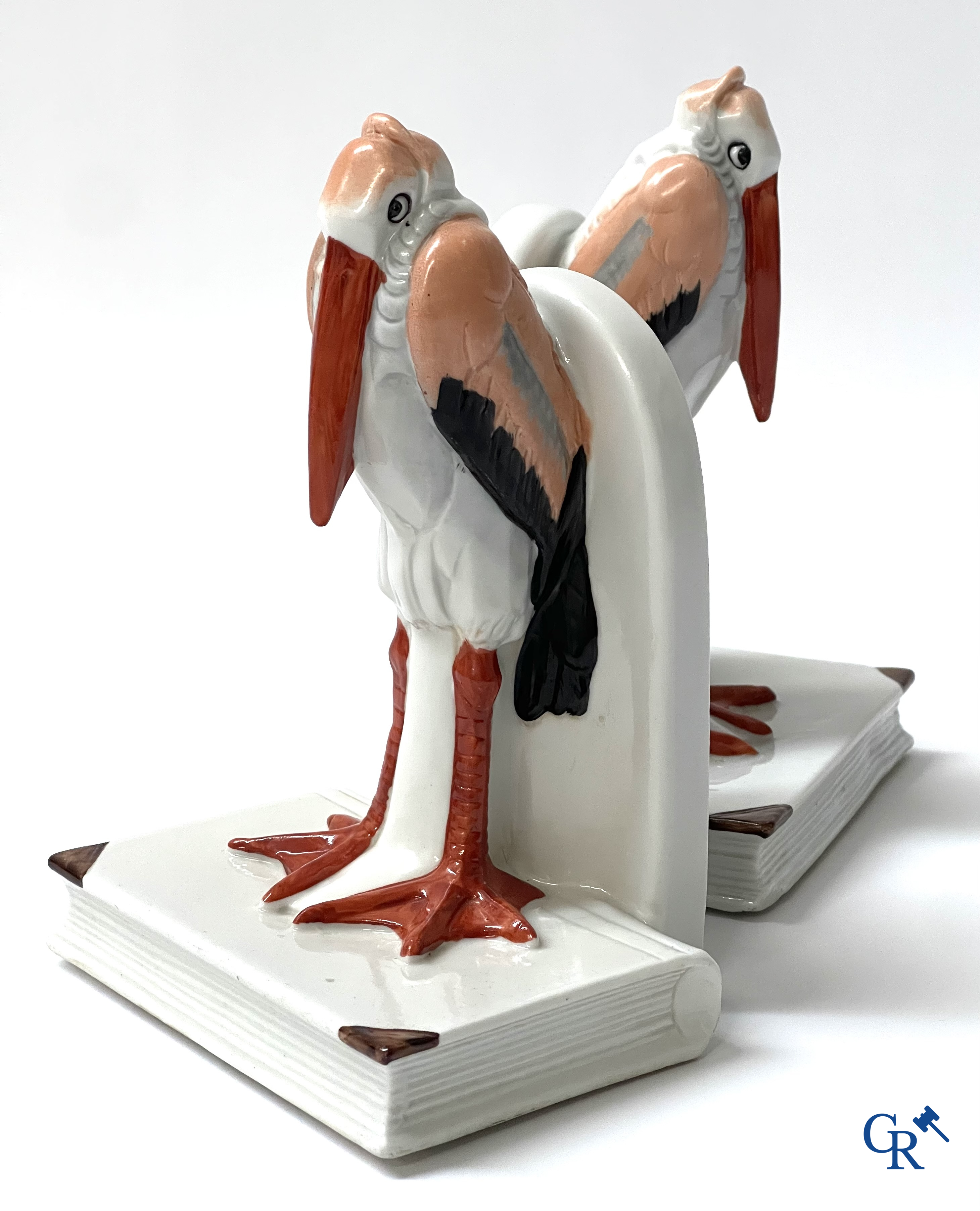 Art Deco, a pair of bookends in polychrome porcelain with a typical Art Deco representation of marabou.