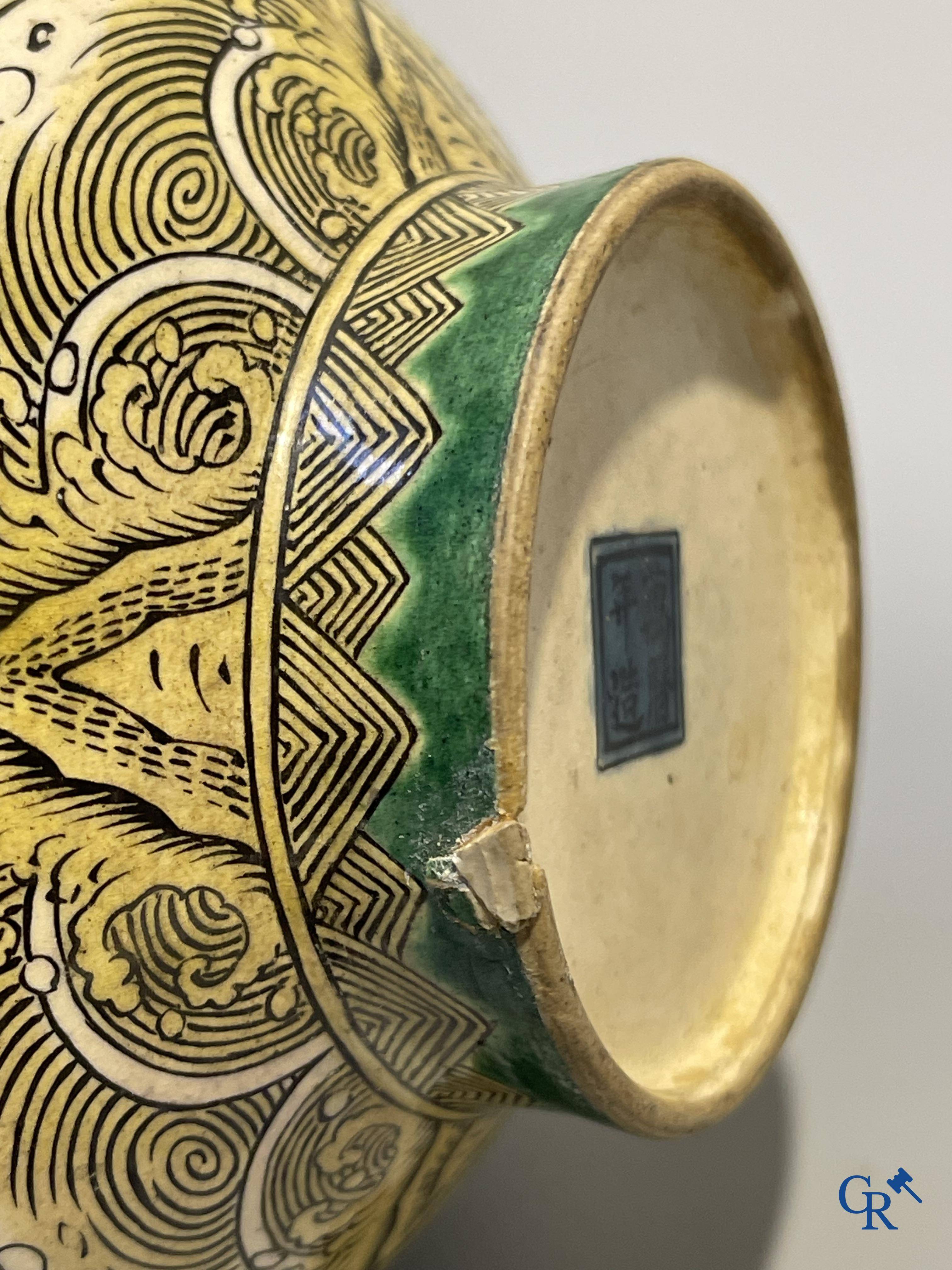 Asian Art, A fine Chinese green and yellow biscuit vase with dragon decor. Marked.