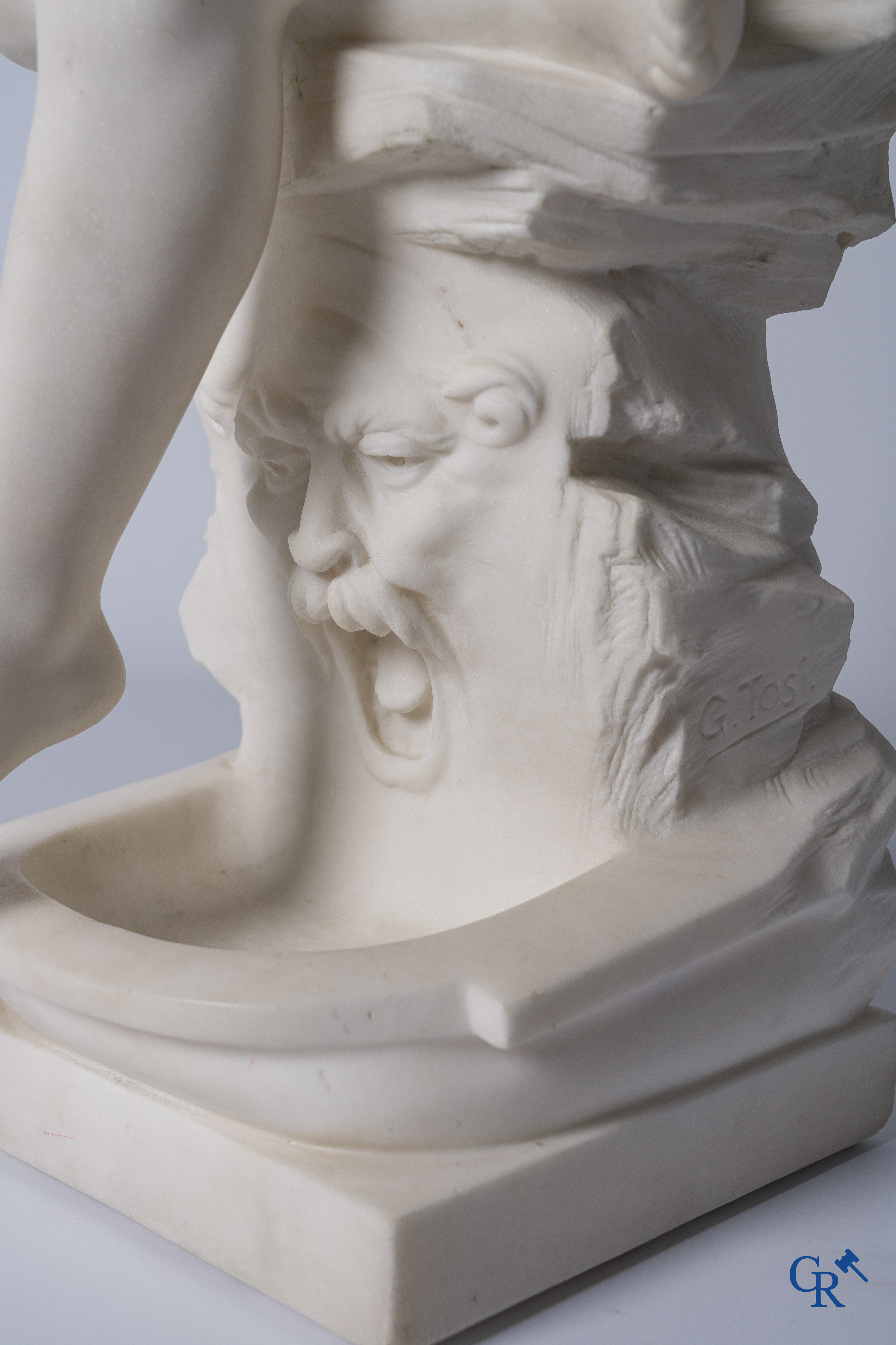 G. Tosi, Beautiful statue in carved marble, seated cupid at wall fountain. Circa 1900.