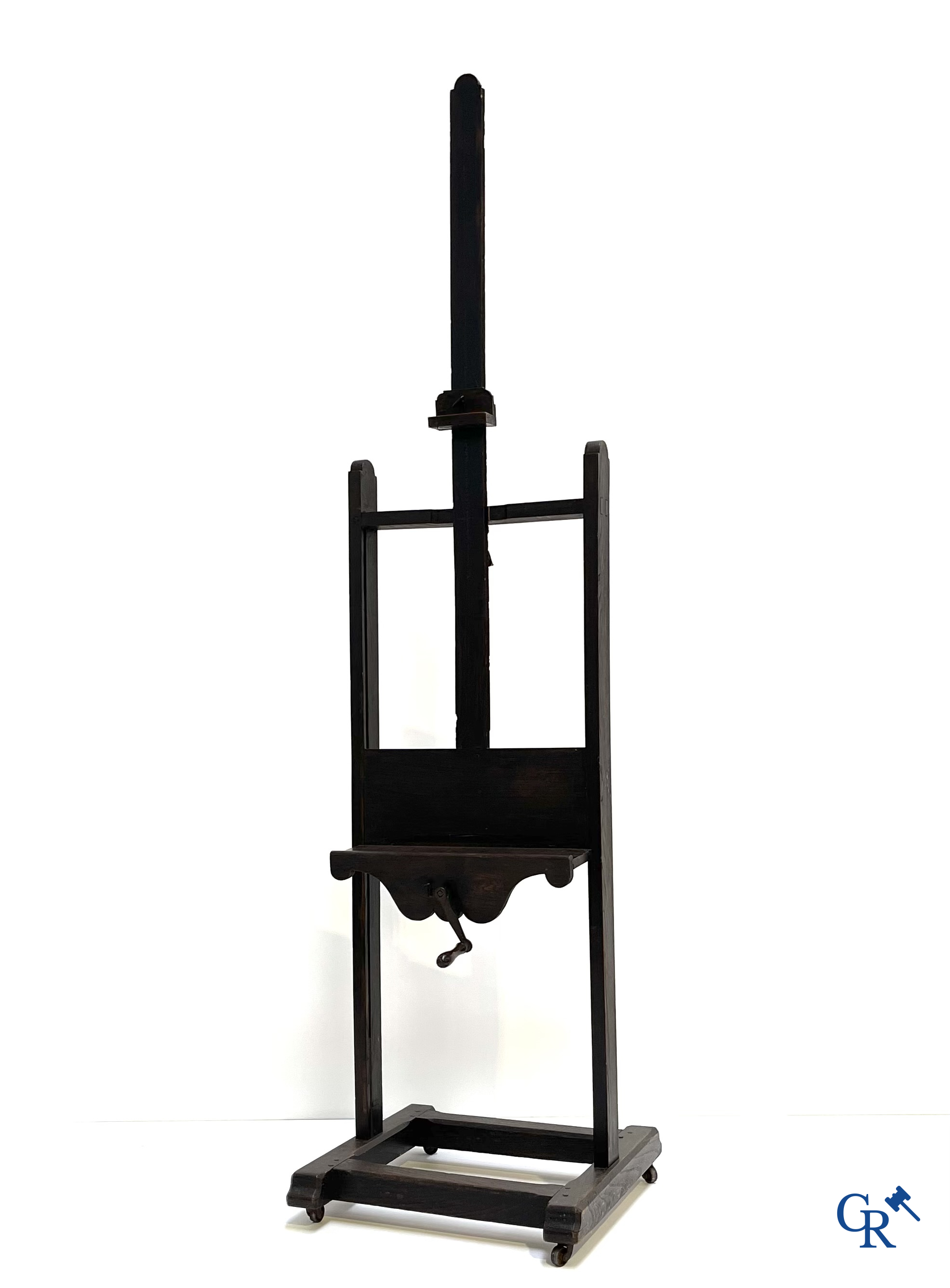 A large antique painter's studio easel with crank adjustment system. 19th century.