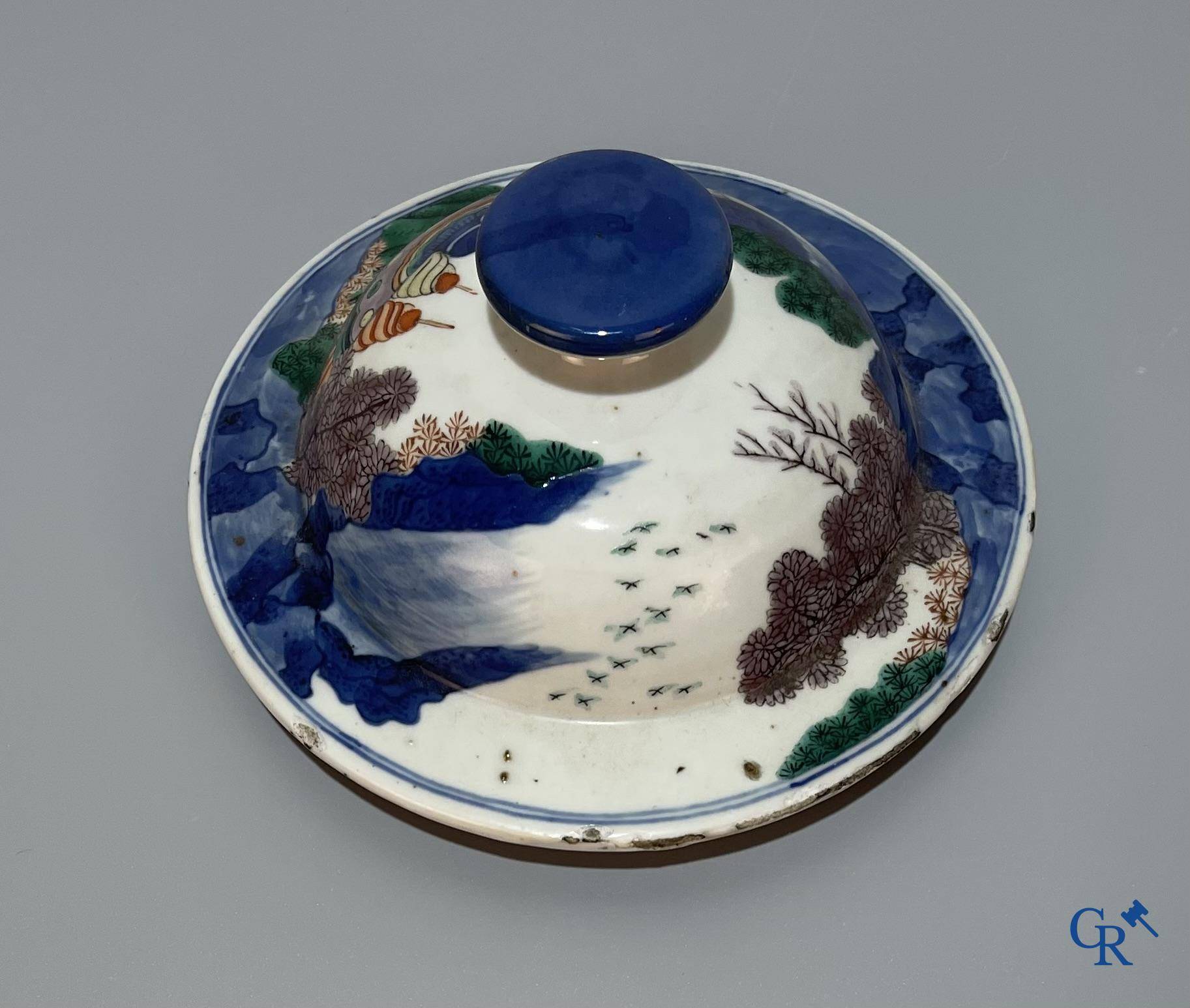 Asian Art, Chinese porcelain, a Chinese Wucai lidded vase with characters.