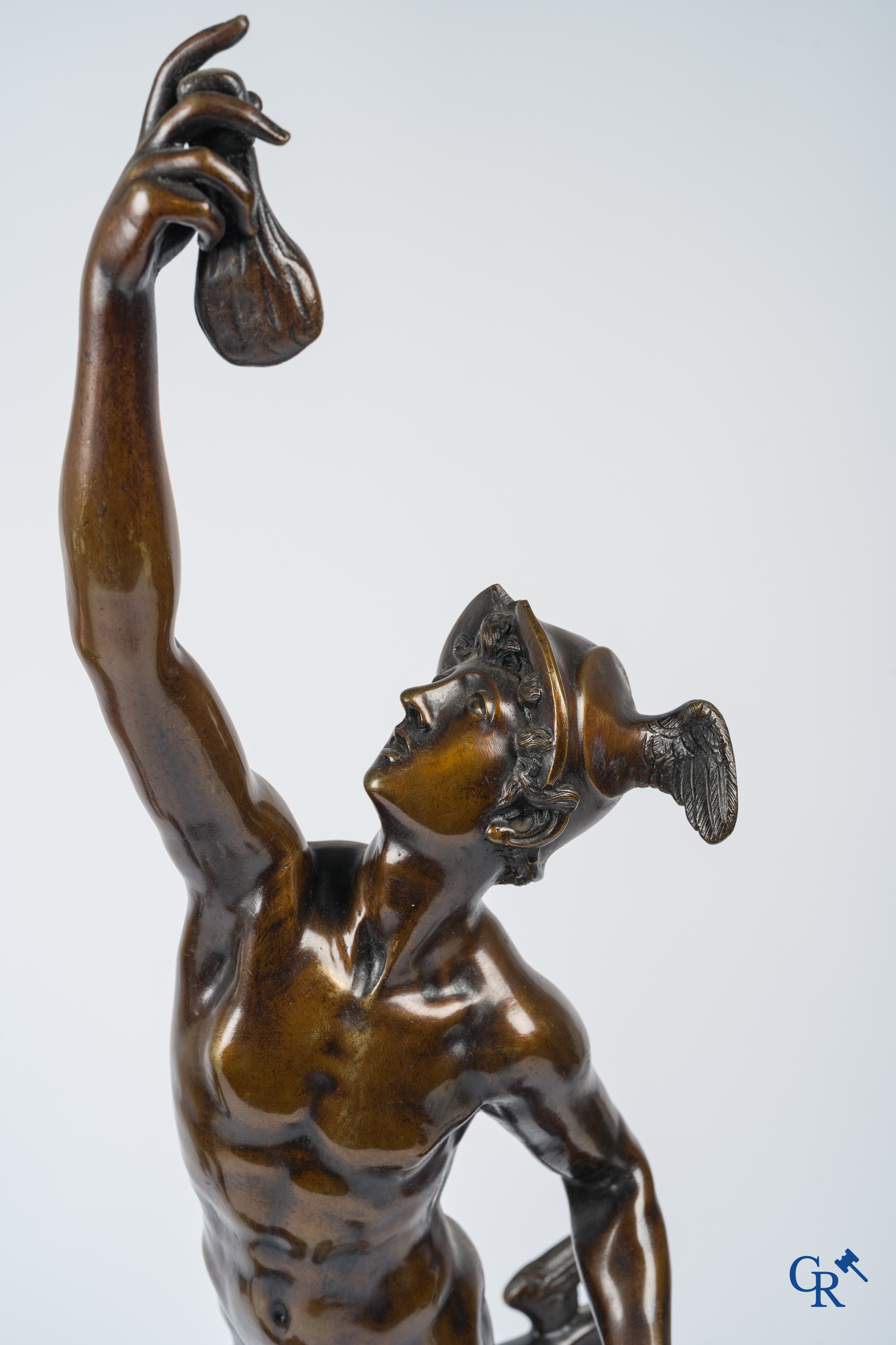 A pair of imposing bronze statues in the antique style after a model by Jean De Bologne.