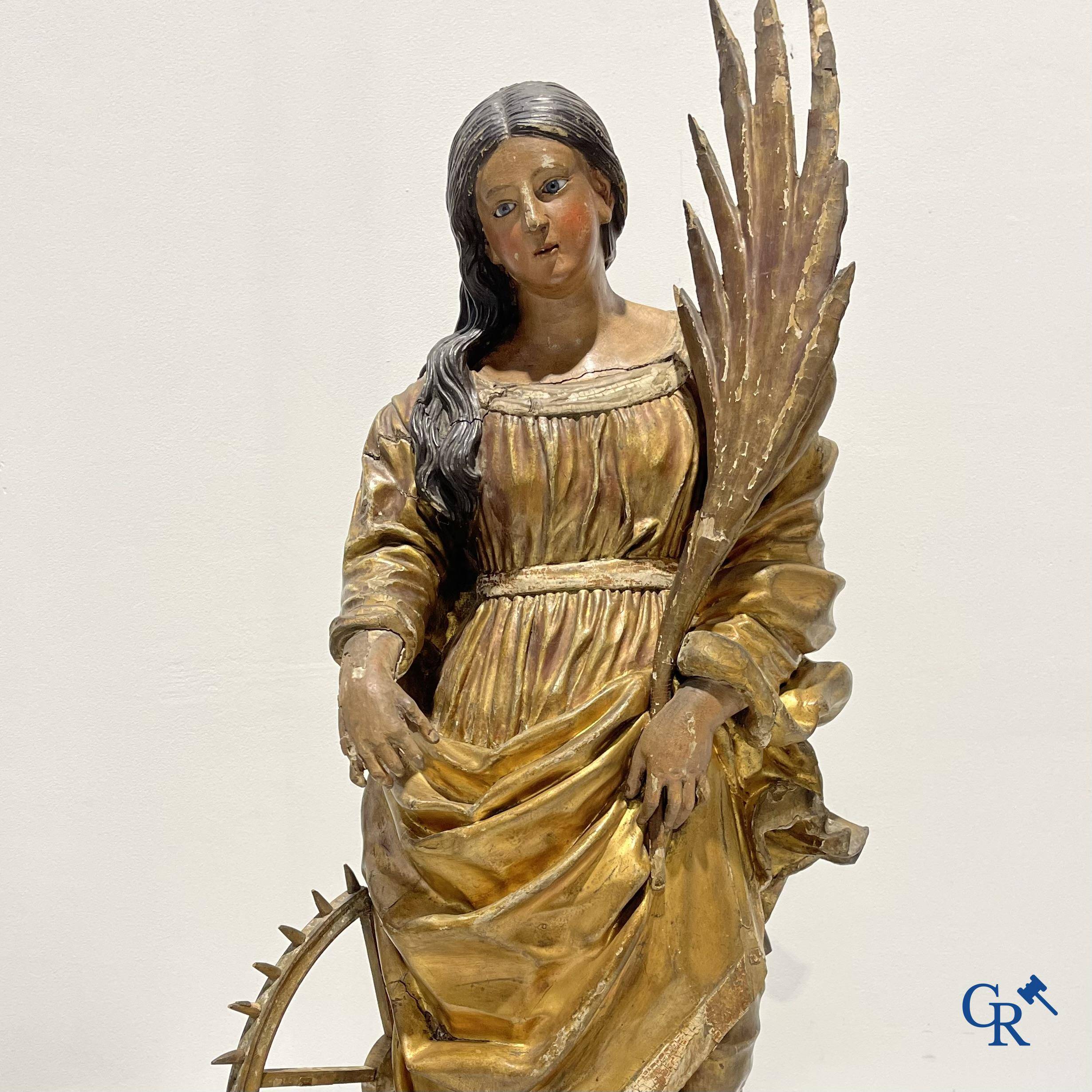 Exceptionally polychrome wooden statue of Saint Catherine of Alexandria with glass eyes, 18th century.