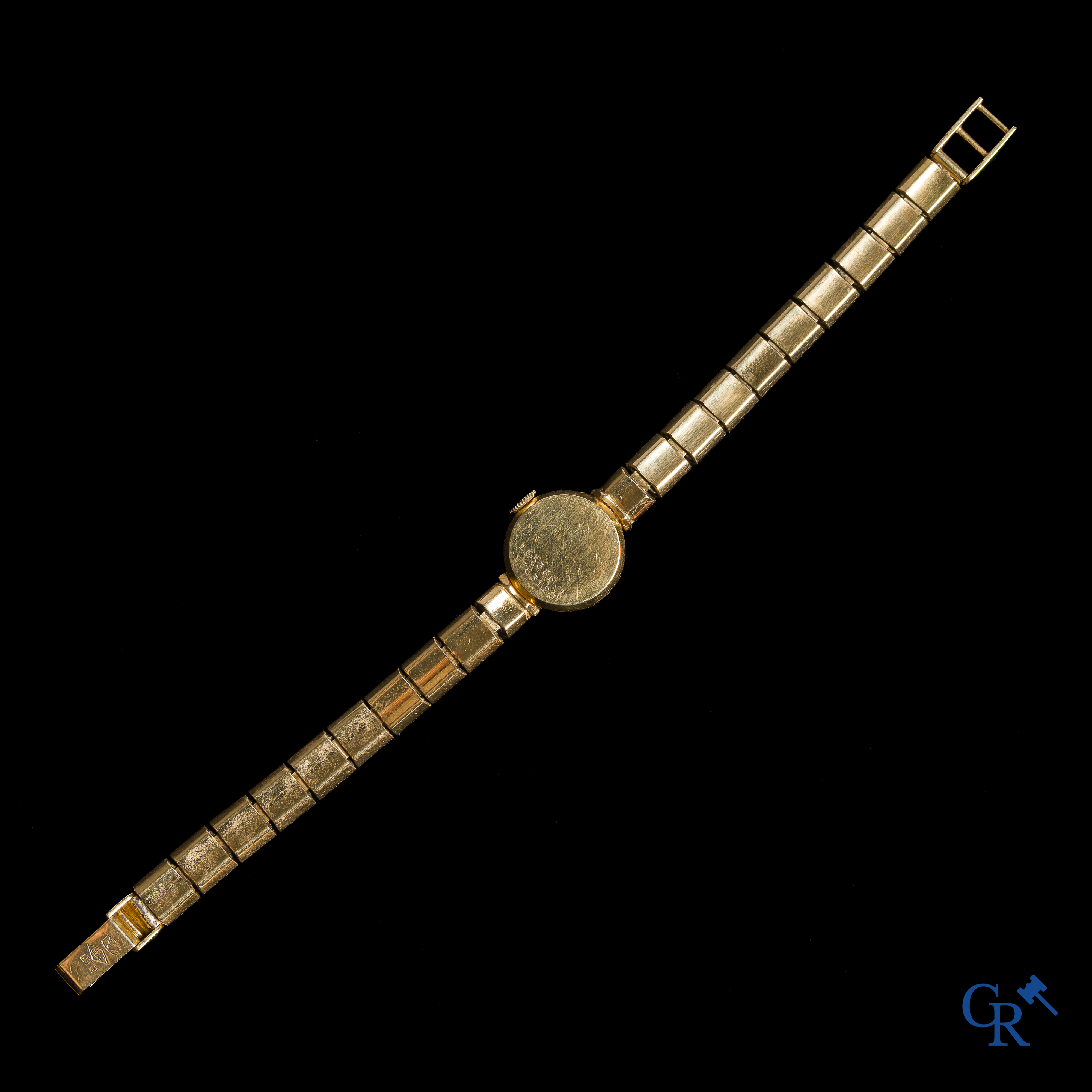 Montres. Travail Suisse, Universal Genève. Montre-bracelet pour femme en or 750°/00.