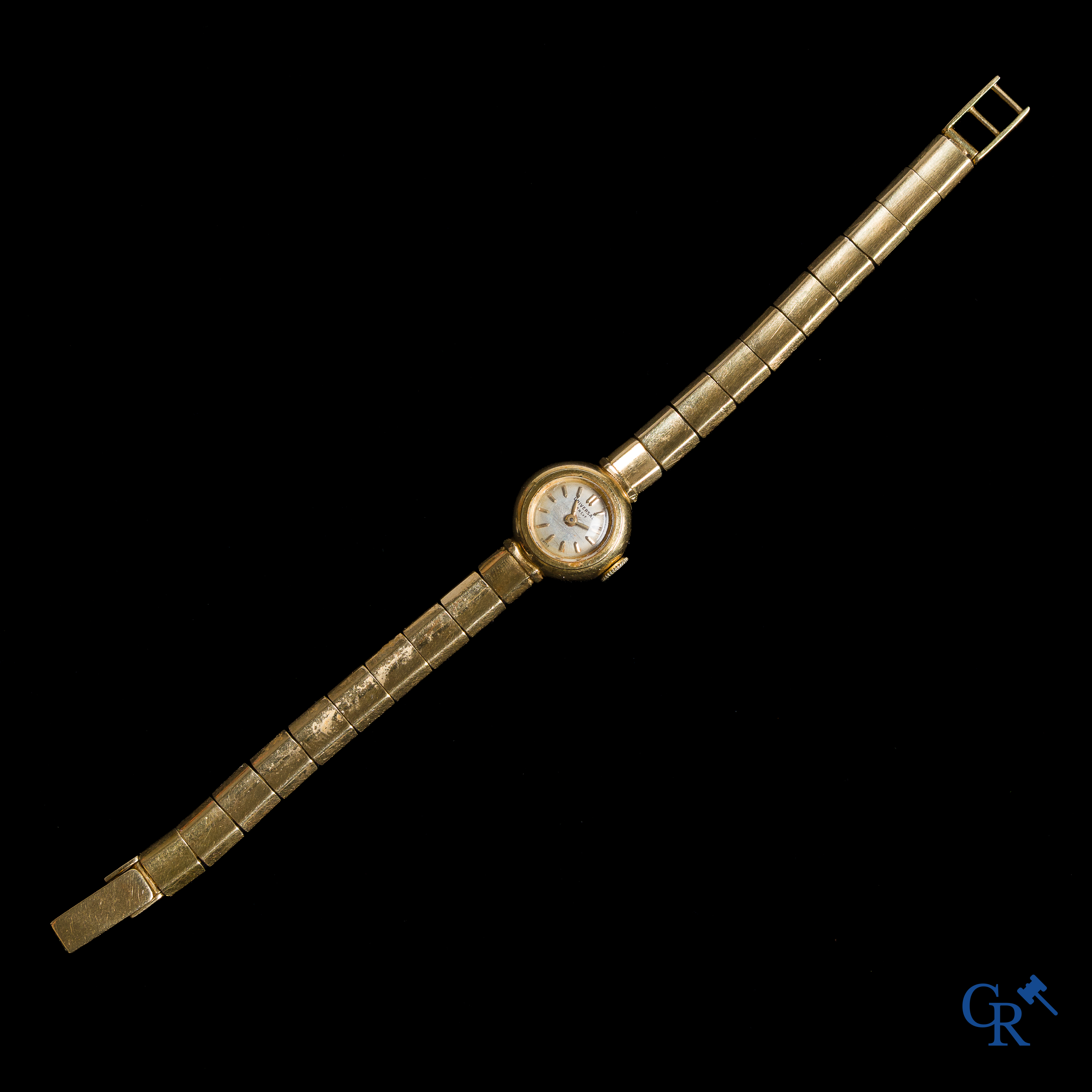 Montres. Travail Suisse, Universal Genève. Montre-bracelet pour femme en or 750°/00.