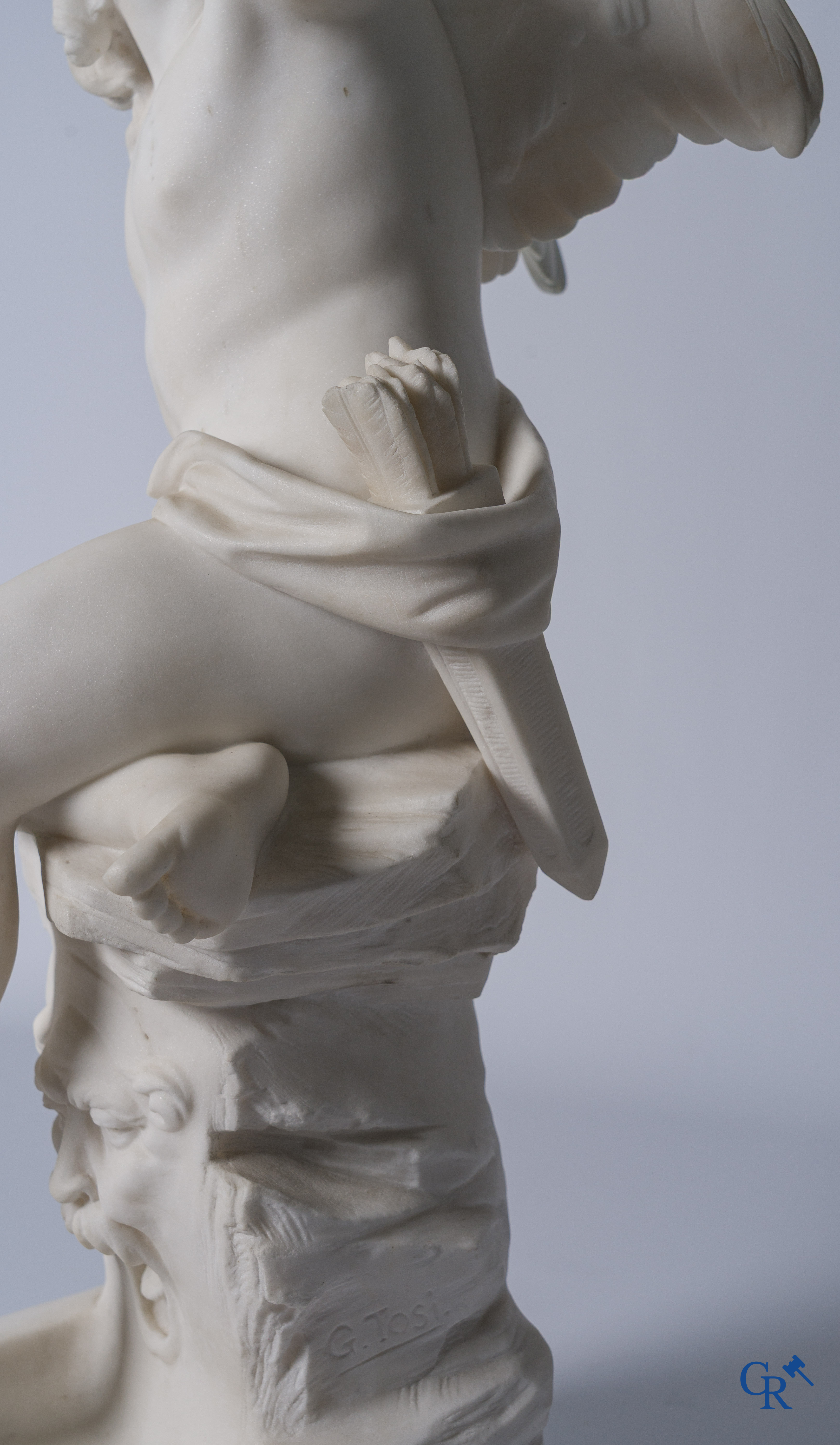 G. Tosi, Beautiful statue in carved marble, seated cupid at wall fountain. Circa 1900.