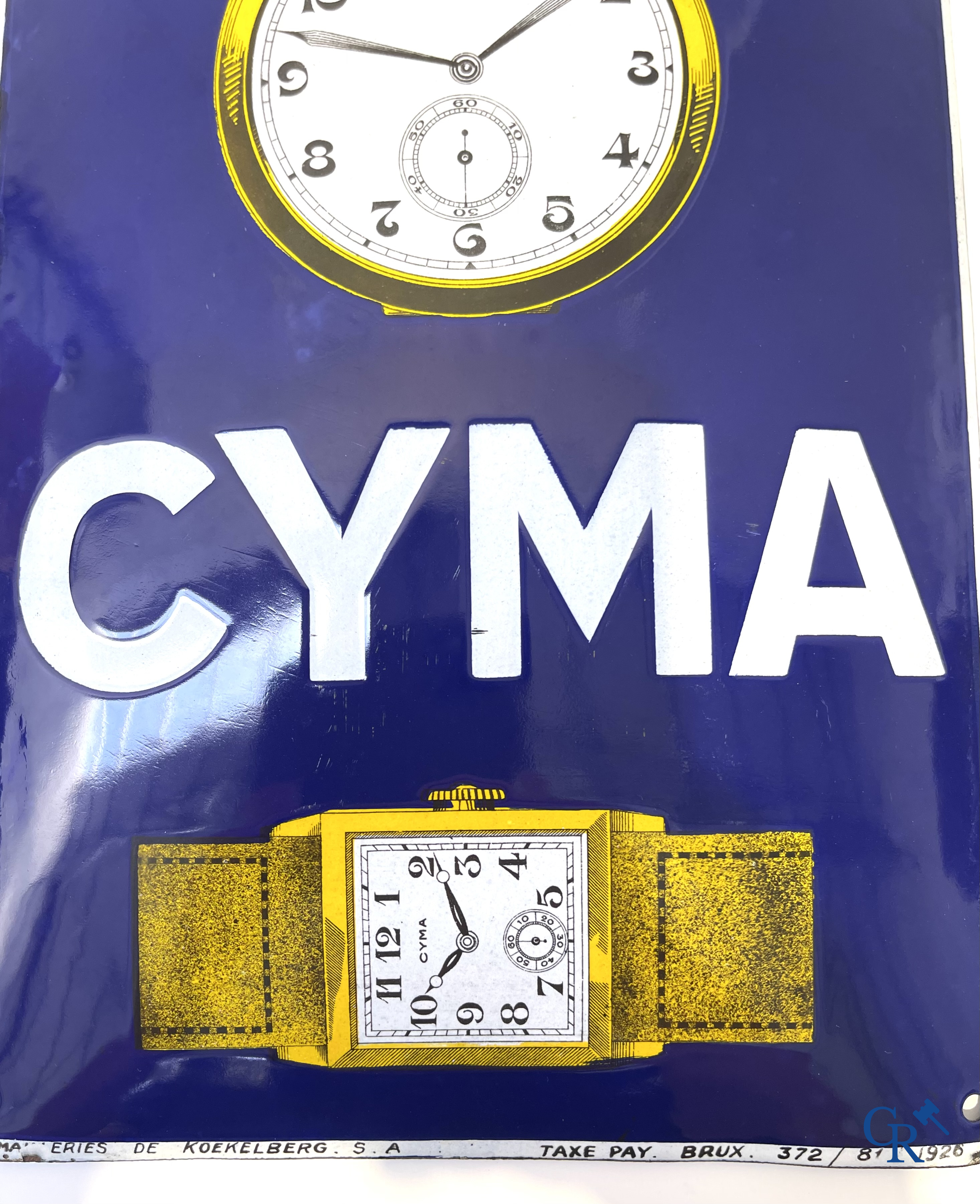 Tavannes Watch Company. Bombed enamel advertising sign for Cyma wrist and pocket watches. 1926.