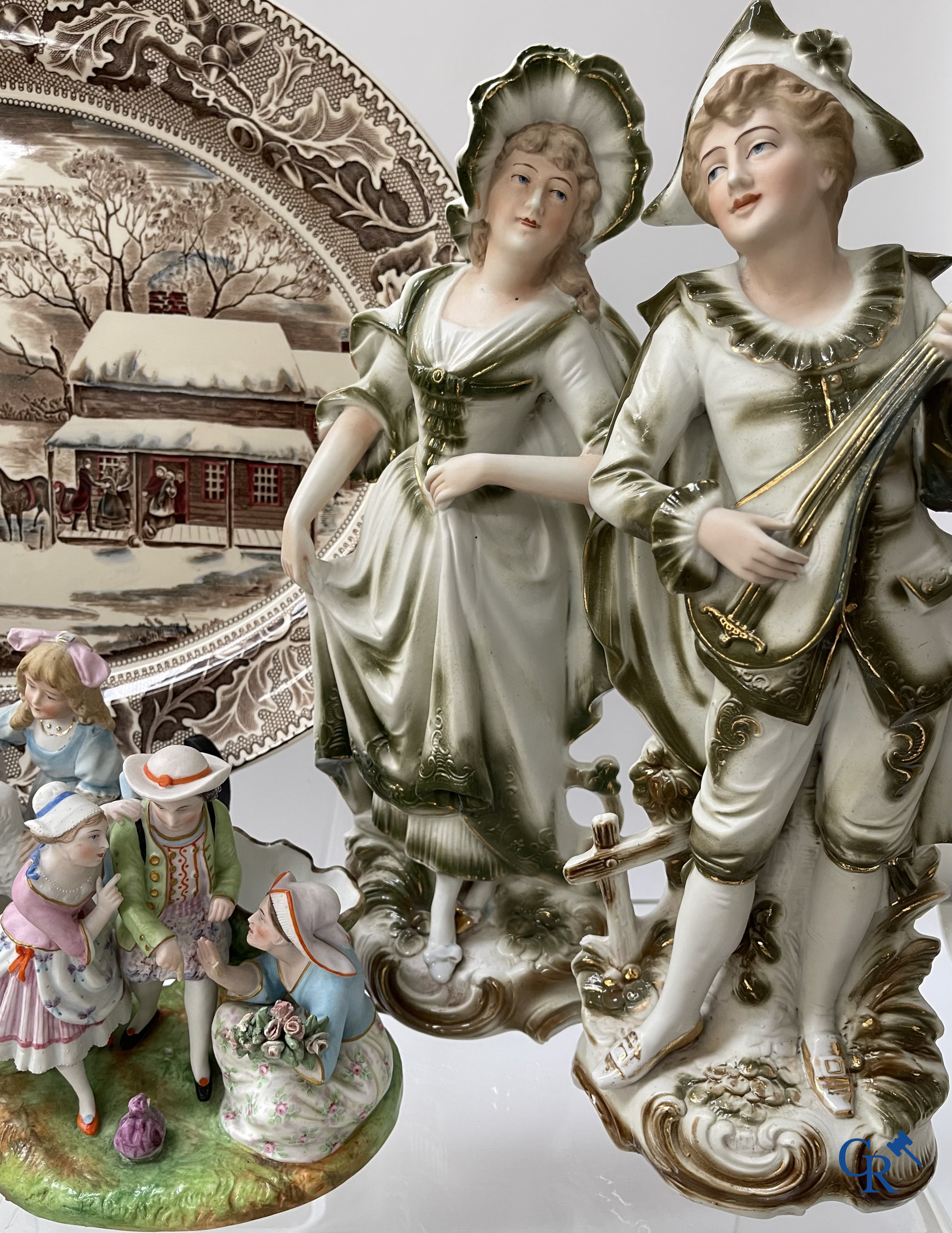 A large lot of brocante including Royal Dux, Biscuit statues, porcelain, globes, spelter statues, table lamp, chandelier etc.