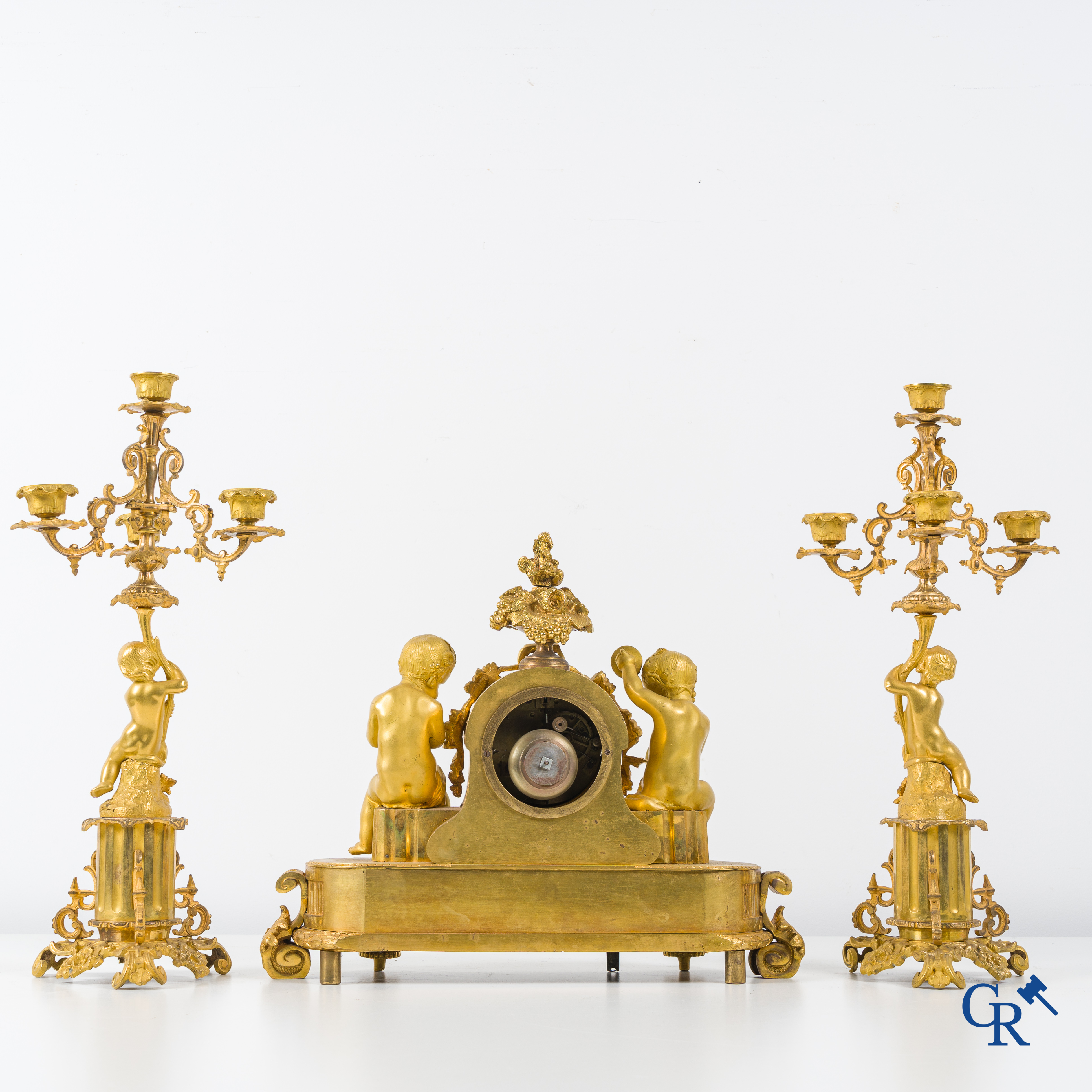 A 3-piece gilded bronze fireplace clockset with Sèvres porcelain.