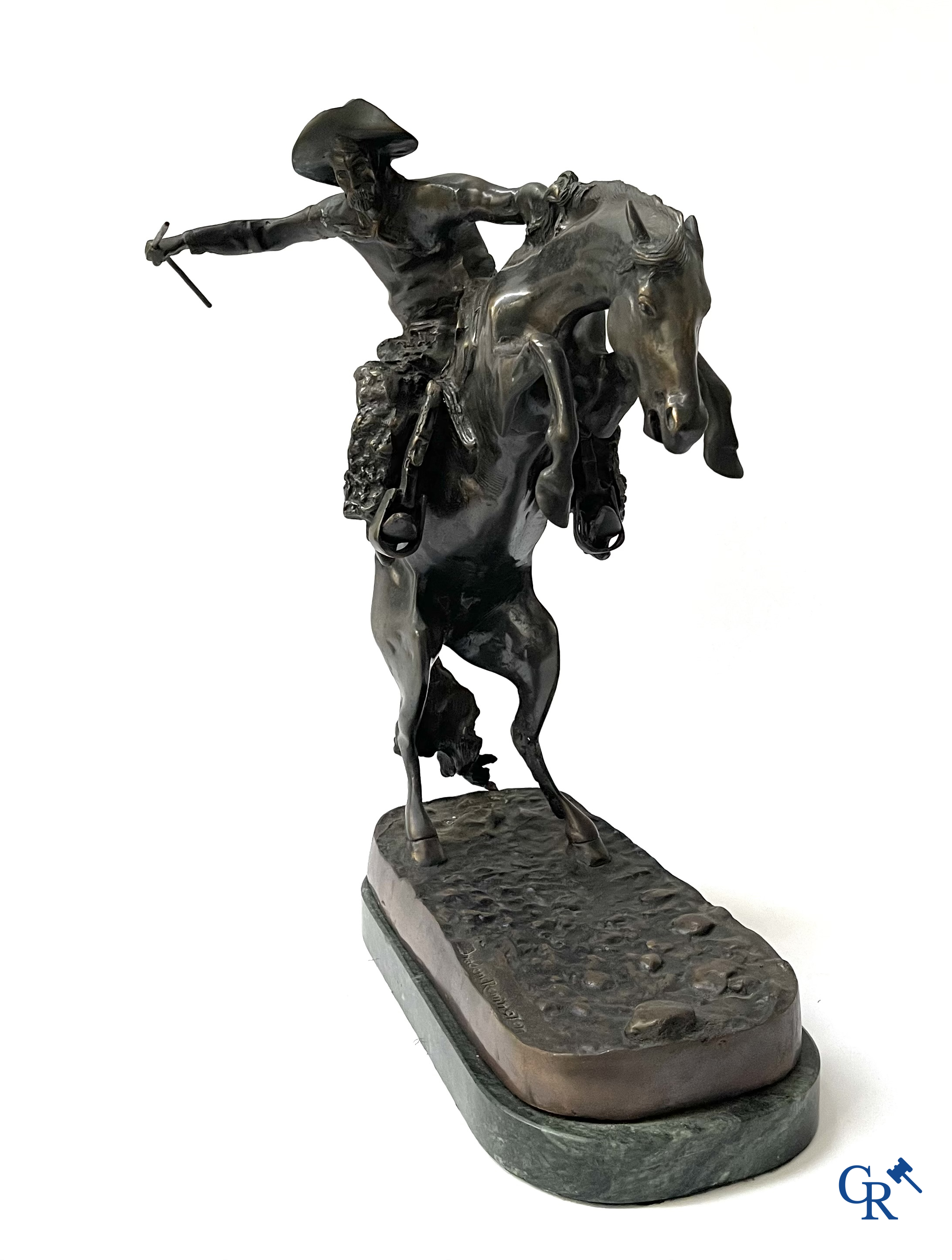 Frederic Remington (after) The bronco buster. Bronze on a green veined marble base. Posthumous. 20th century.