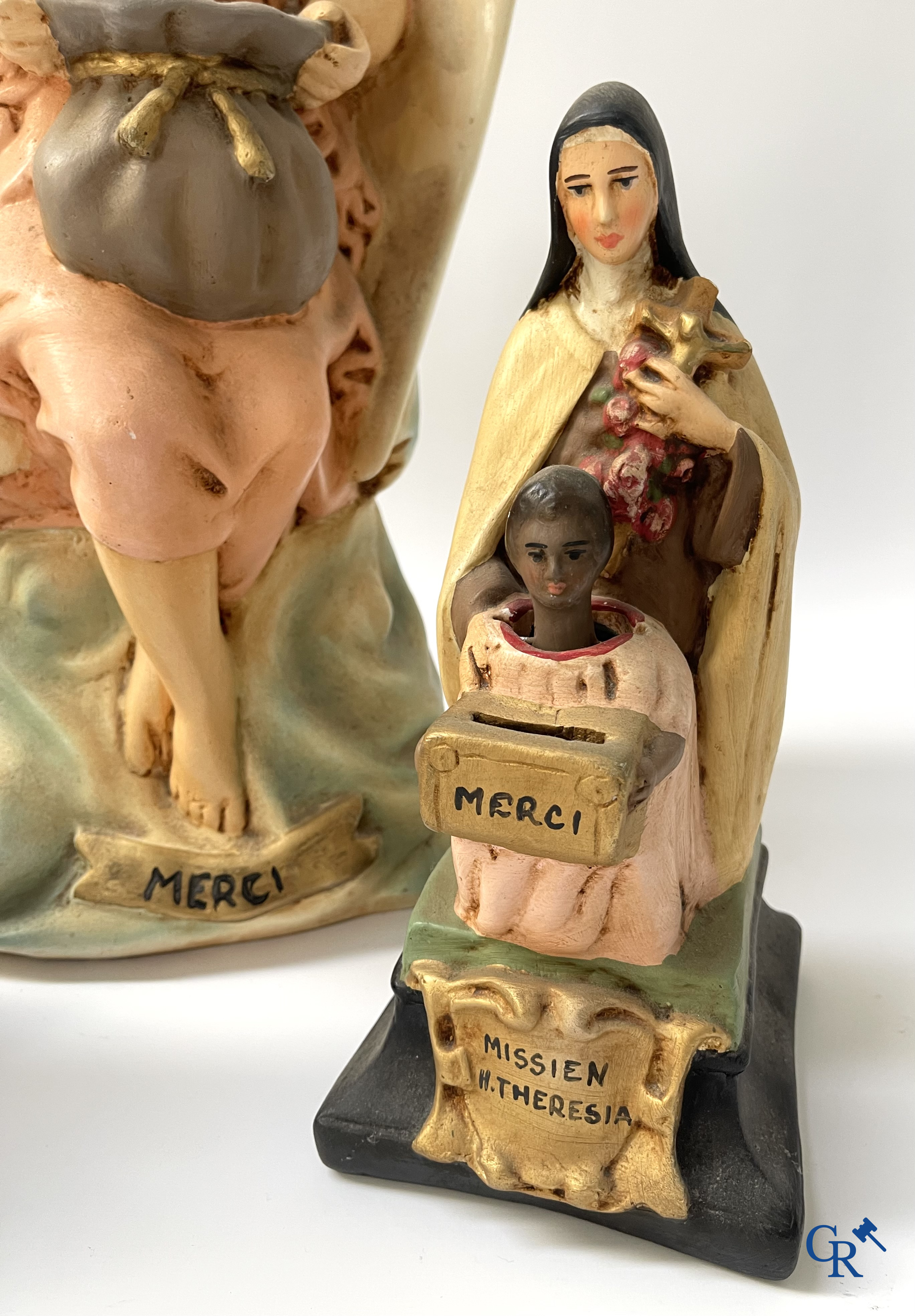 3 plaster piggy banks with nodding heads for the benefit of the Holy Missions.