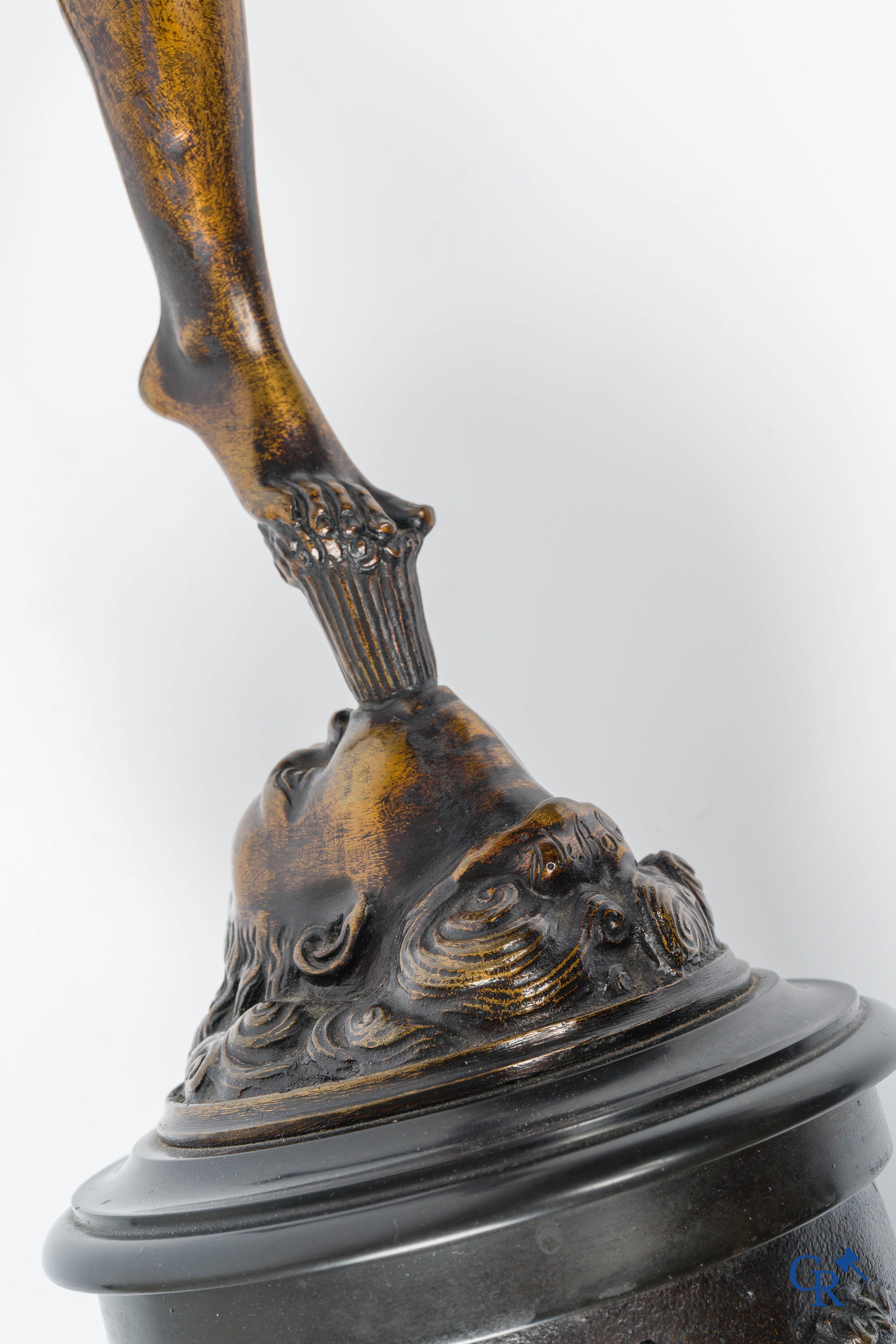 A pair of imposing bronze statues in the antique style after a model by Jean De Bologne.