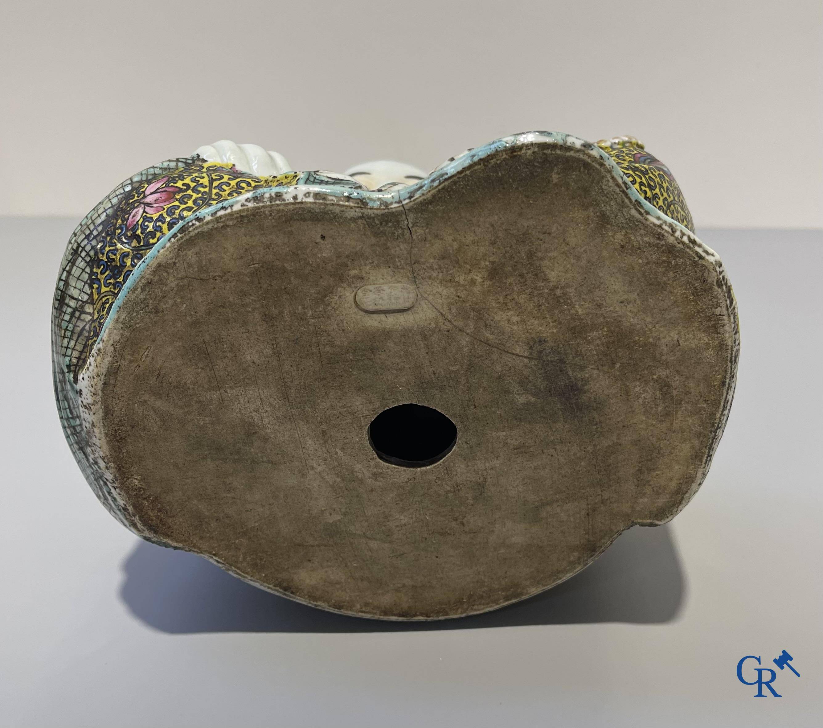 Asian Art, Chinese porcelain. A Chinese famille rose figure of a Buddha with a seal mark. 19th century.