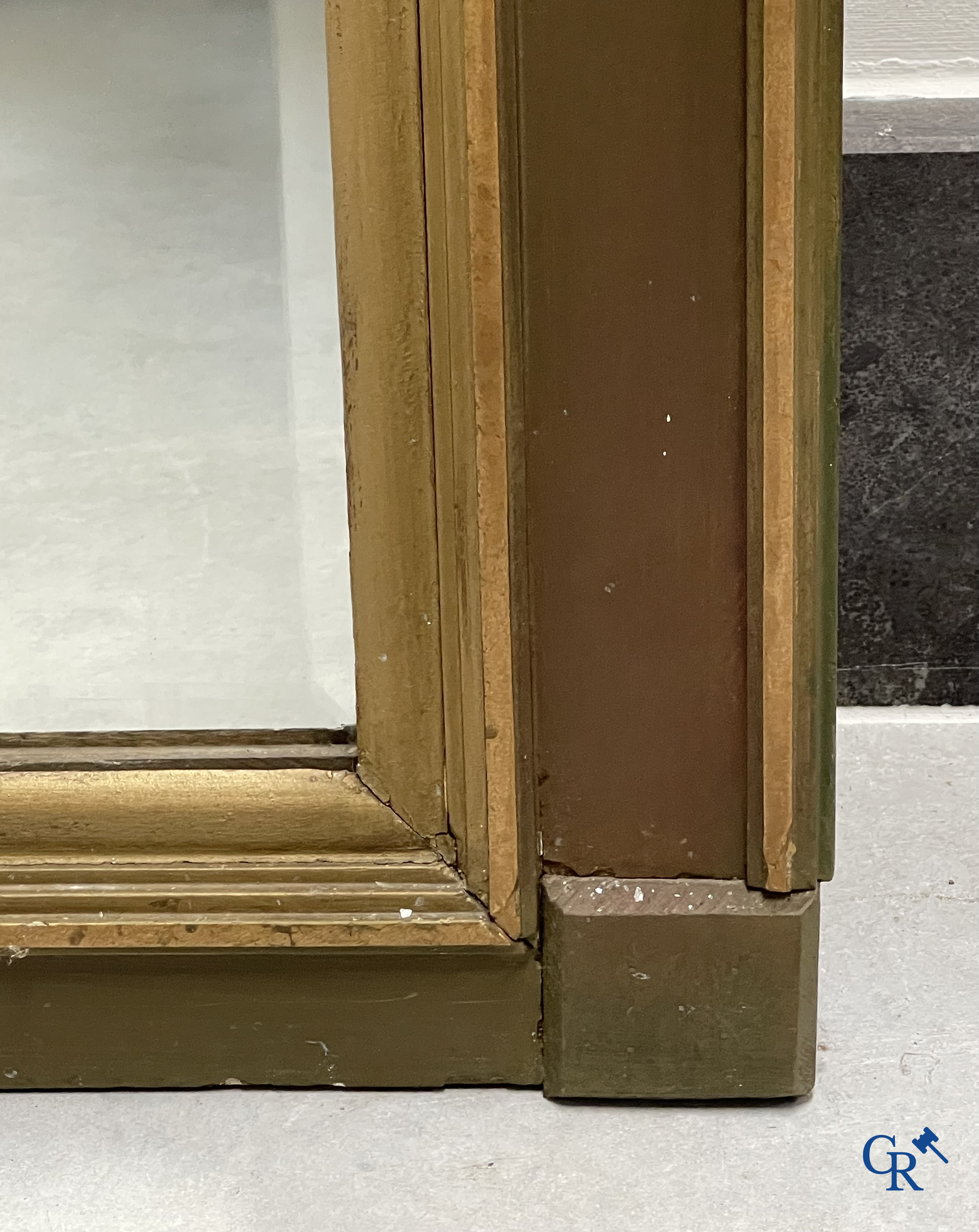 A large patinated fireplace mirror with a dragon. Around 1900.