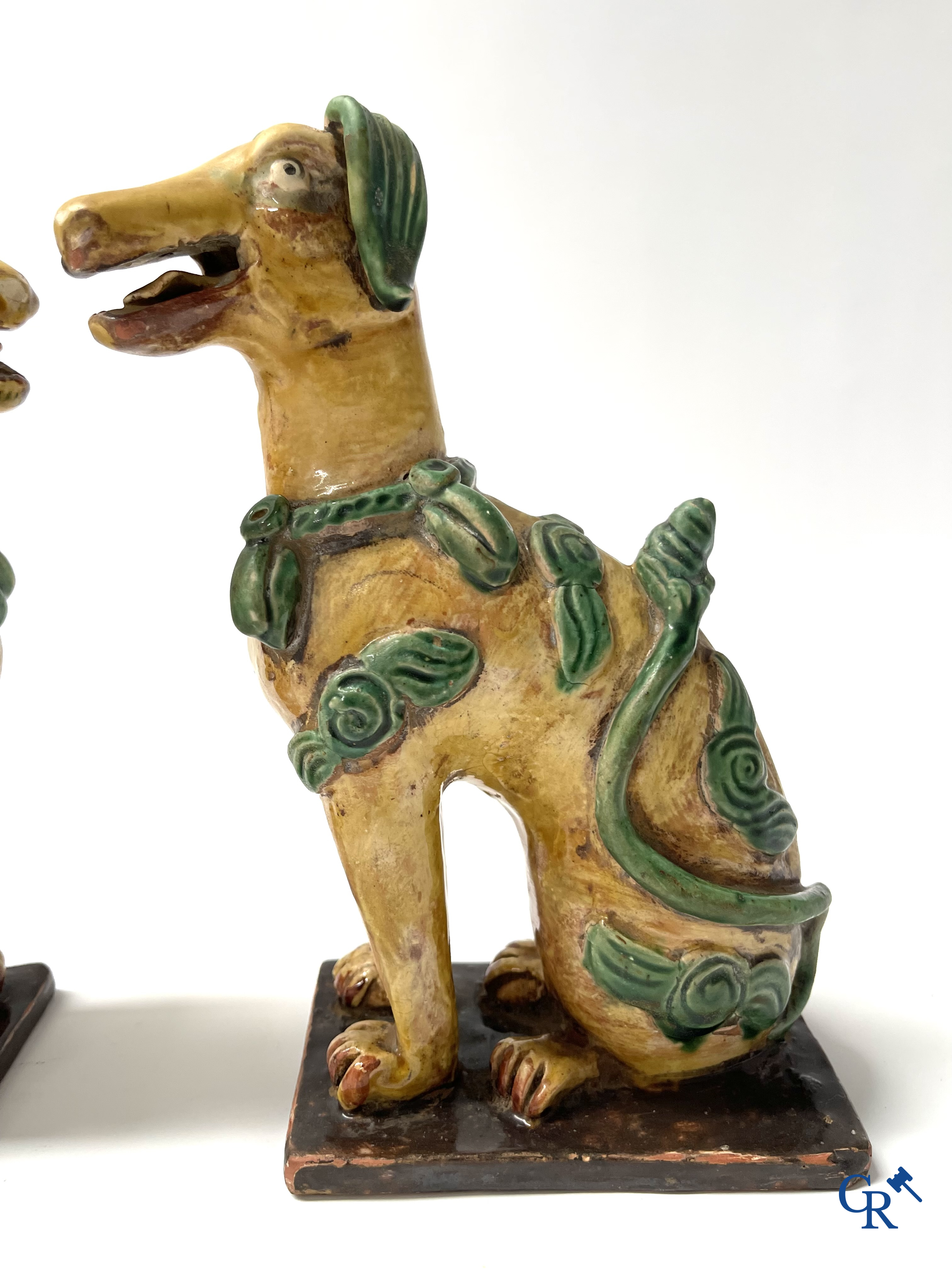 Asian Art, Chine. A pair of seated enamelled terra cotta dogs.