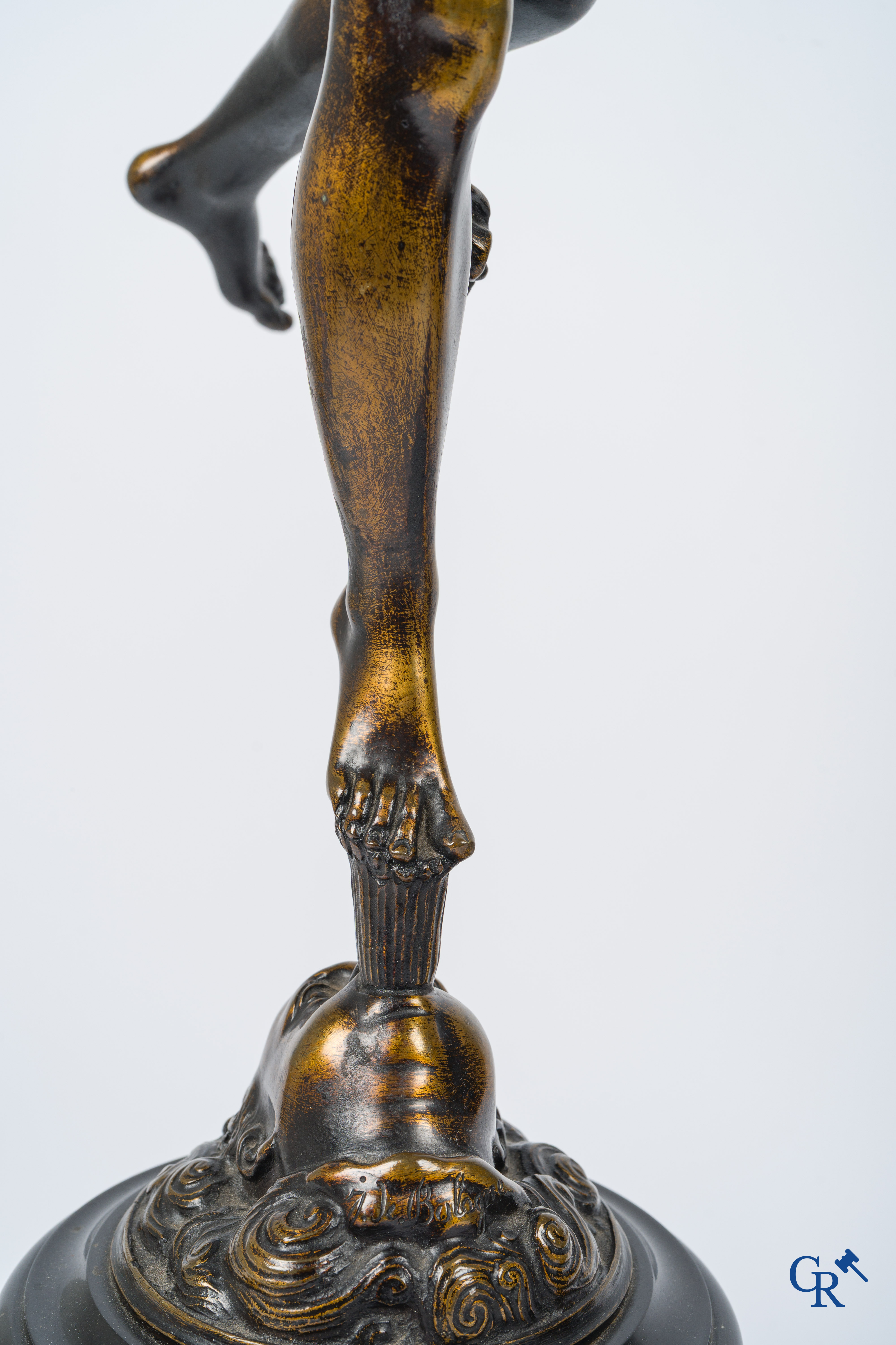 A pair of imposing bronze statues in the antique style after a model by Jean De Bologne.