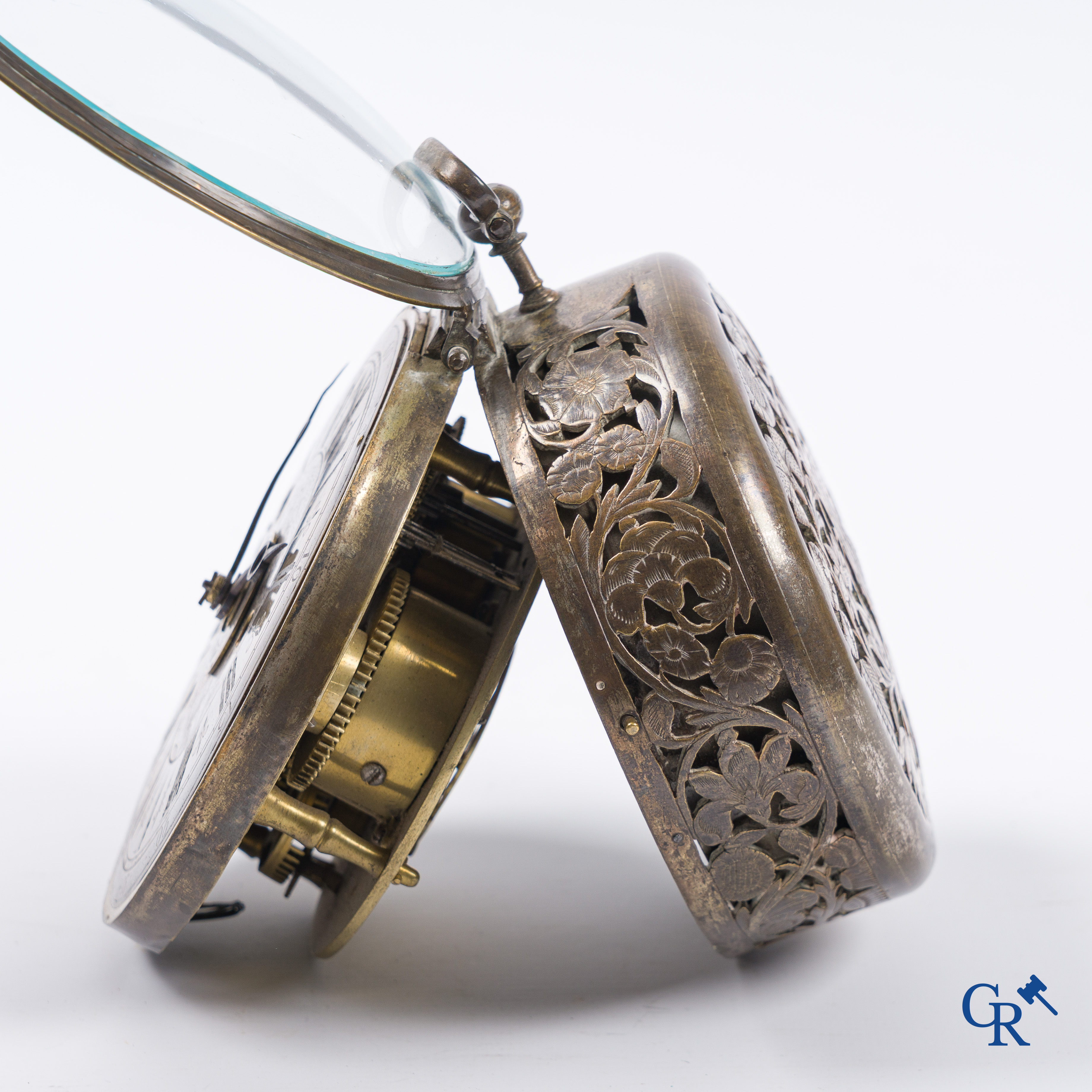 Clocks and watches. Montre de carosse. Large carriage watch with engraved and perforated case. France 17th century.