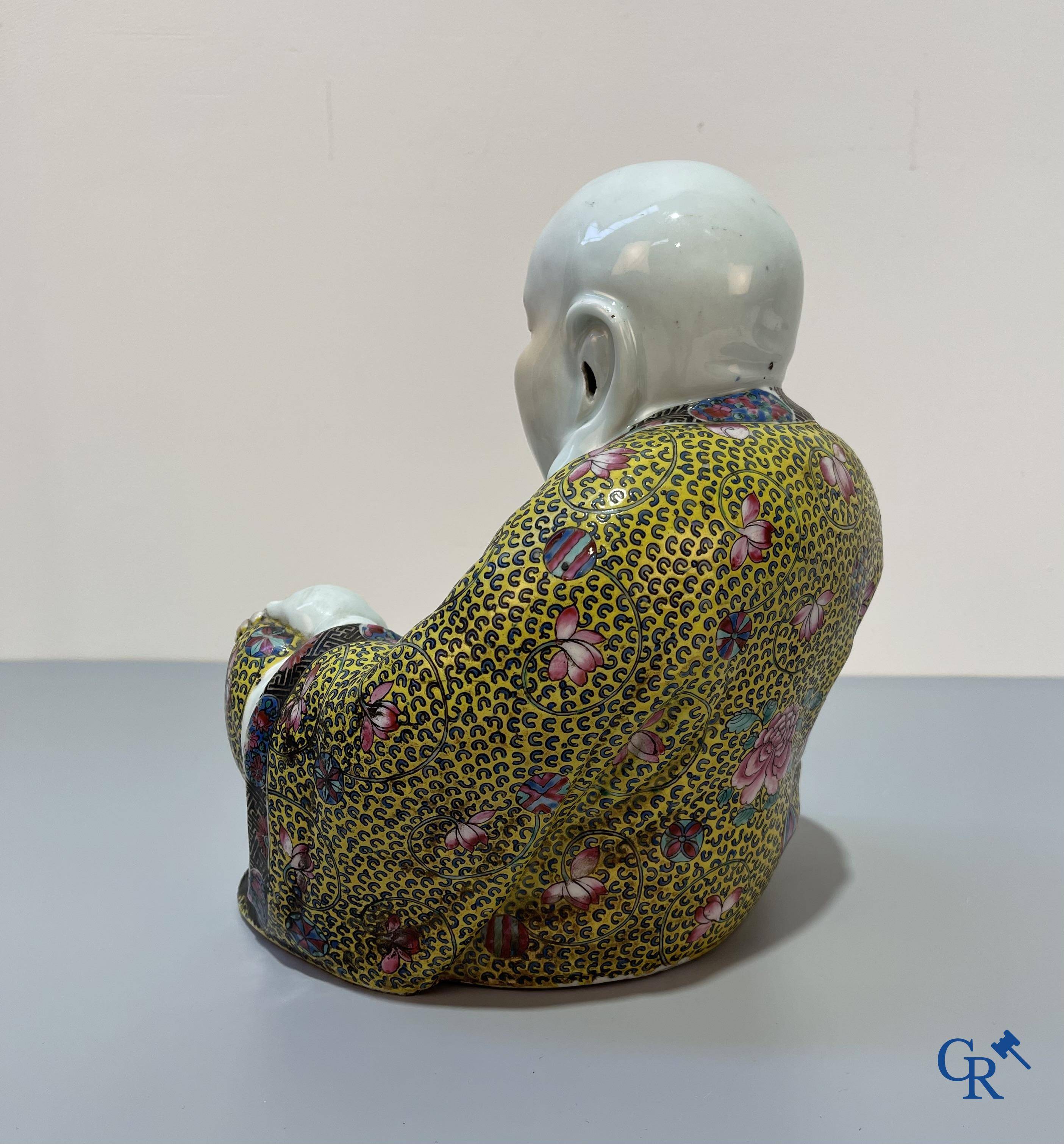 Asian Art, Chinese porcelain. A Chinese famille rose figure of a Buddha with a seal mark. 19th century.