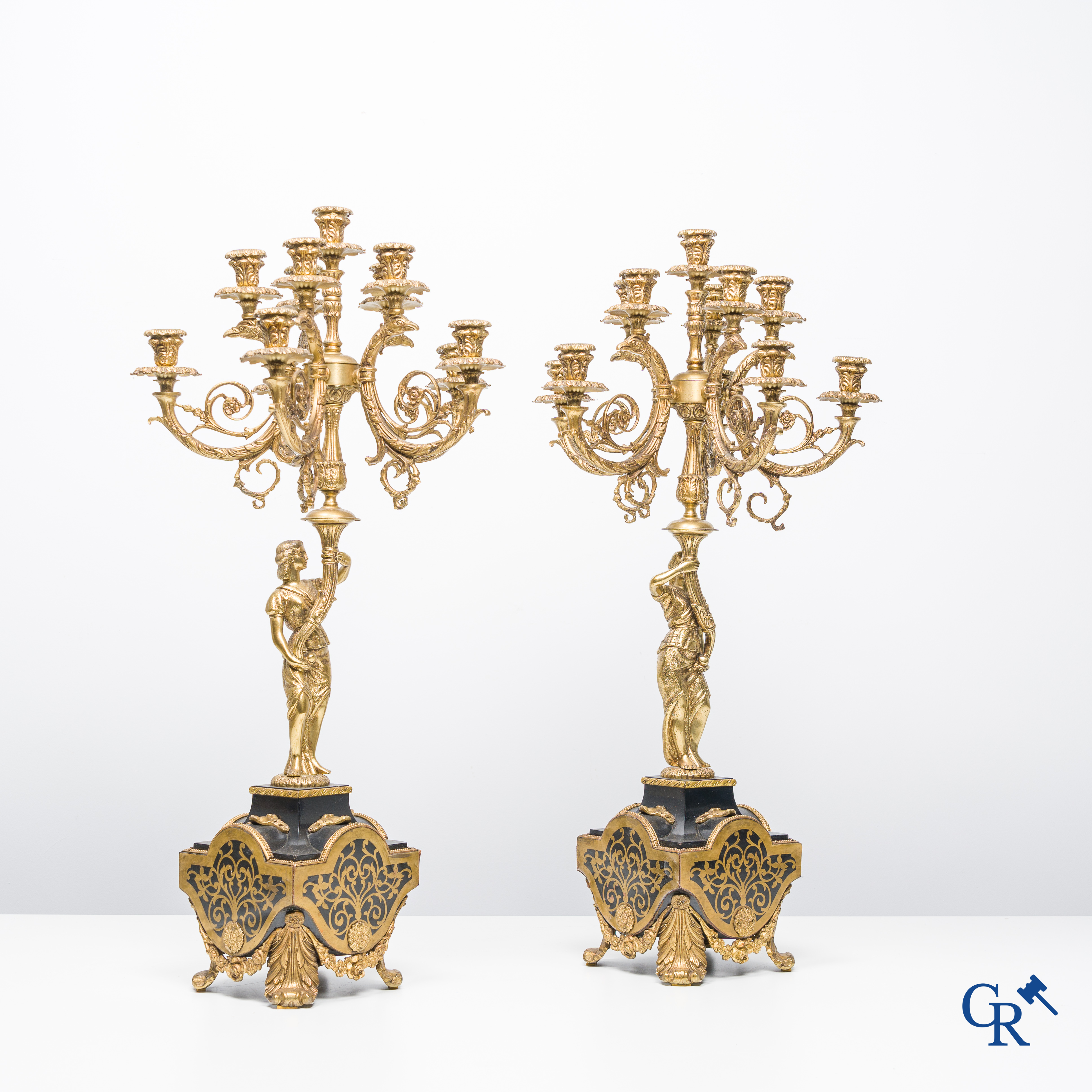 An imposing 3-piece chimney clock set in bronze and Boulle technique.