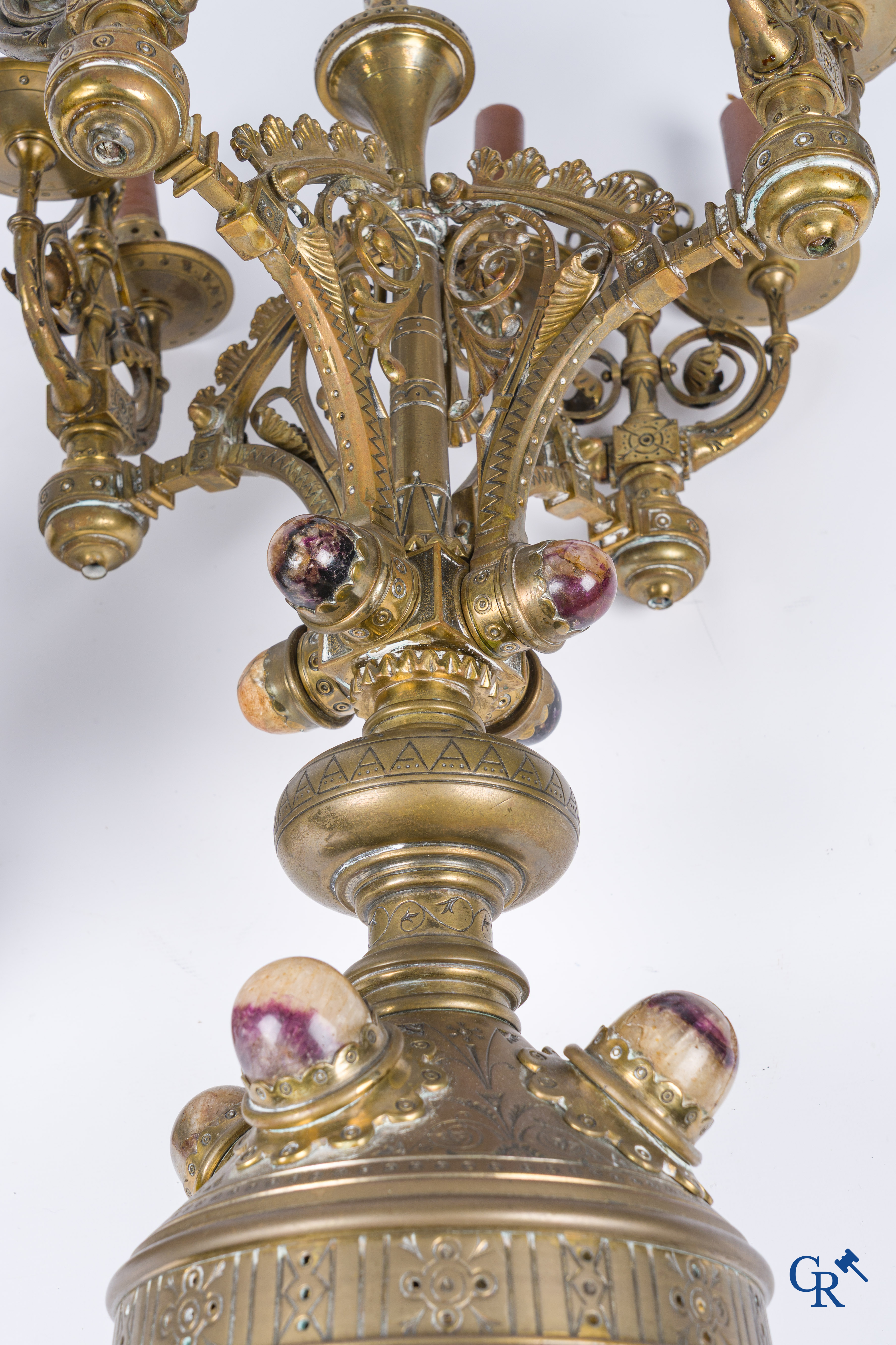 A pair of important bronze candlesticks decorated with various types of rock including amethyst. 19th century.