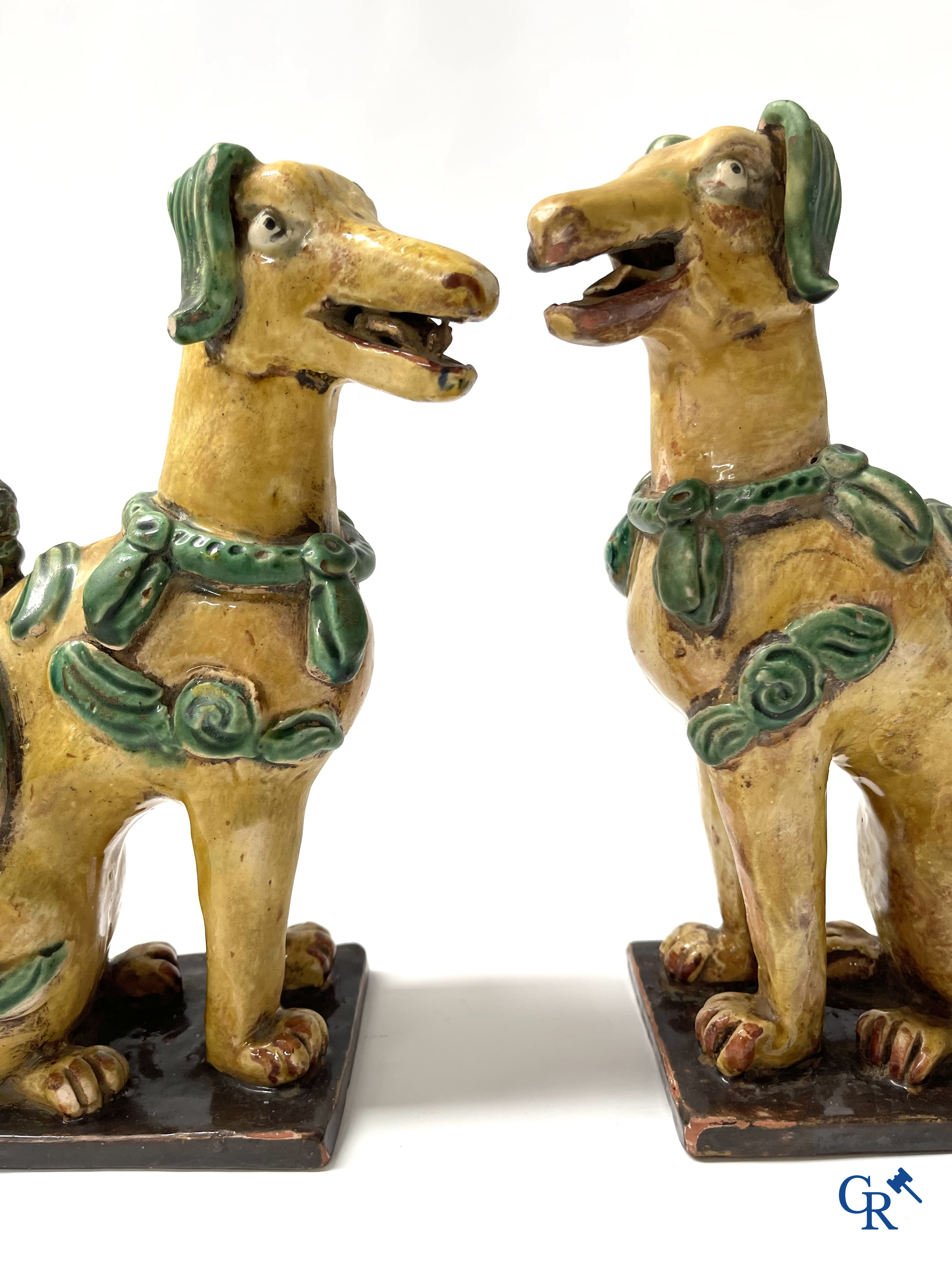 Asian Art, Chine. A pair of seated enamelled terra cotta dogs.