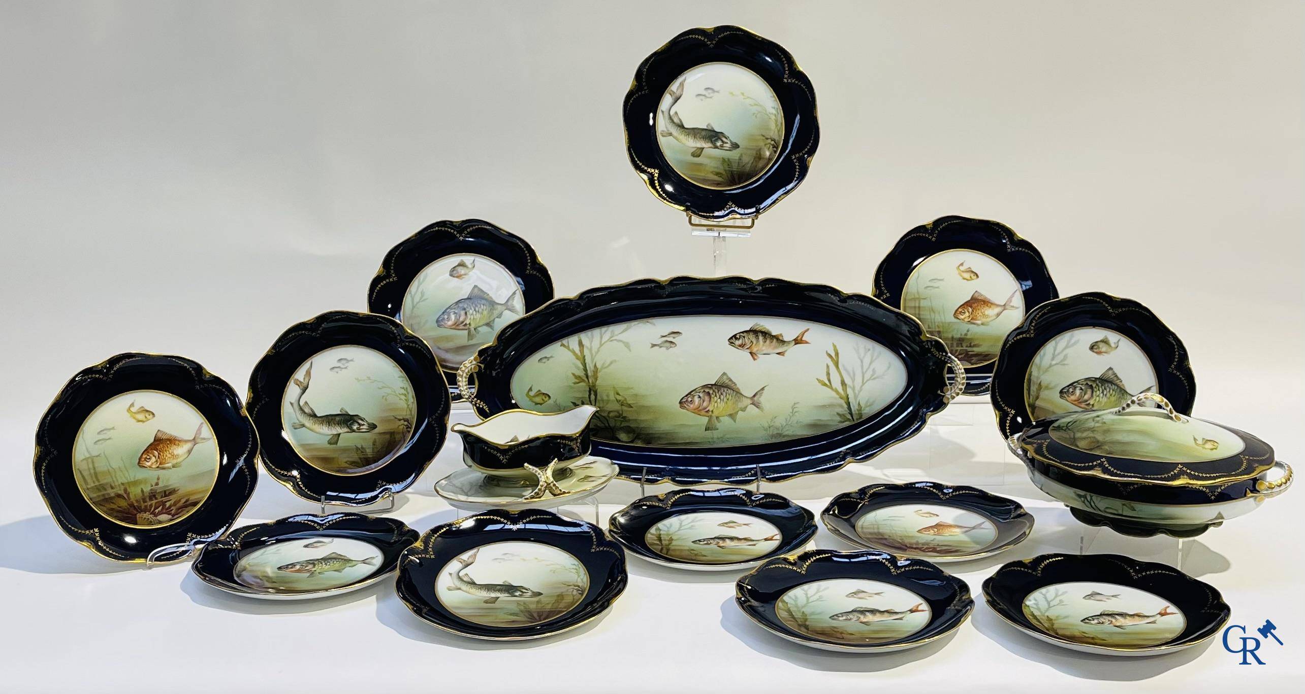 Porselein: Tafelservies met een decor van vissen in Rosenthal porselein.