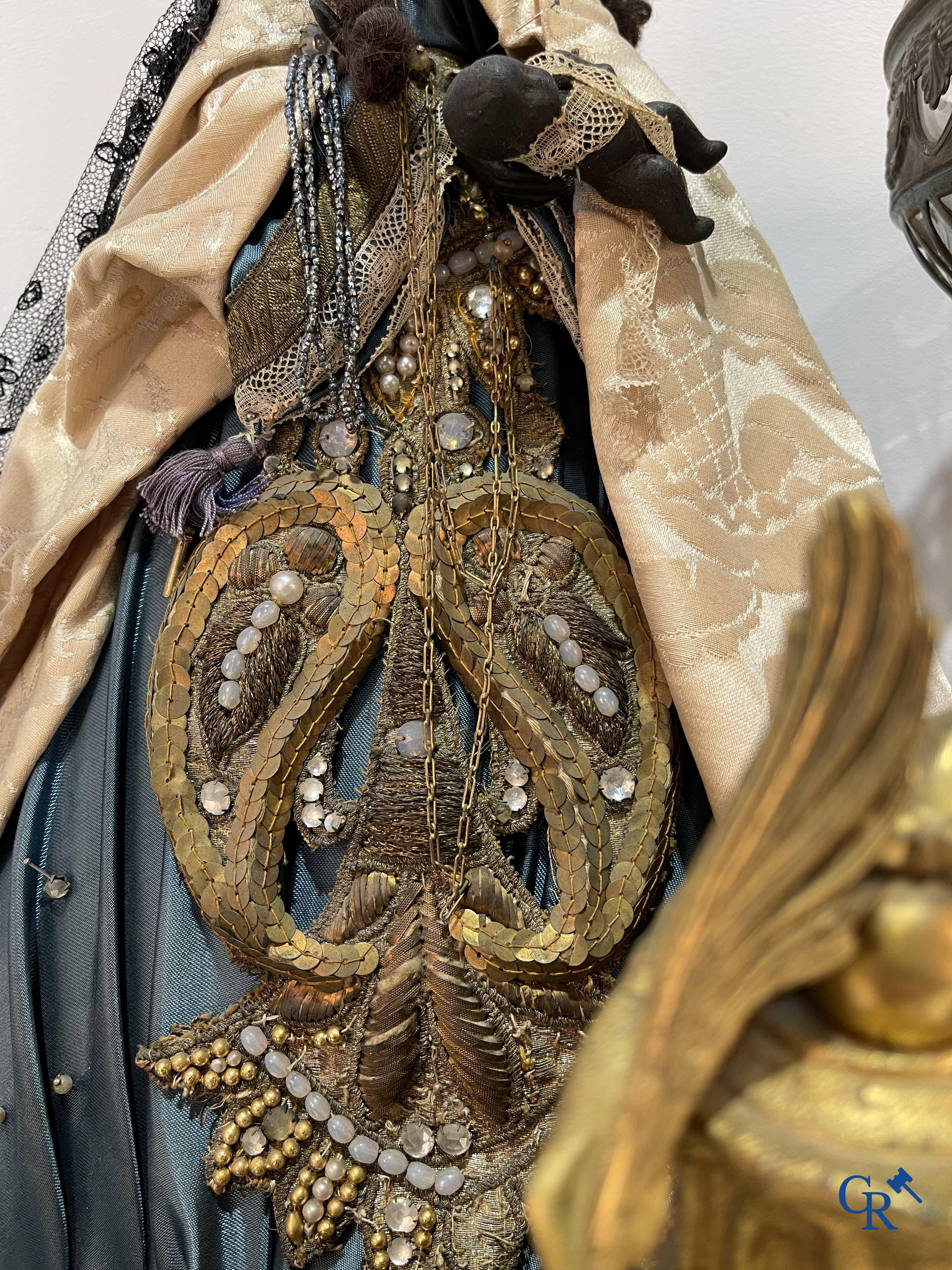 A lot with brocante: Bronze clock, bronze neo Gothic candlesticks and a statue of St. Catharina, soliflore etc.