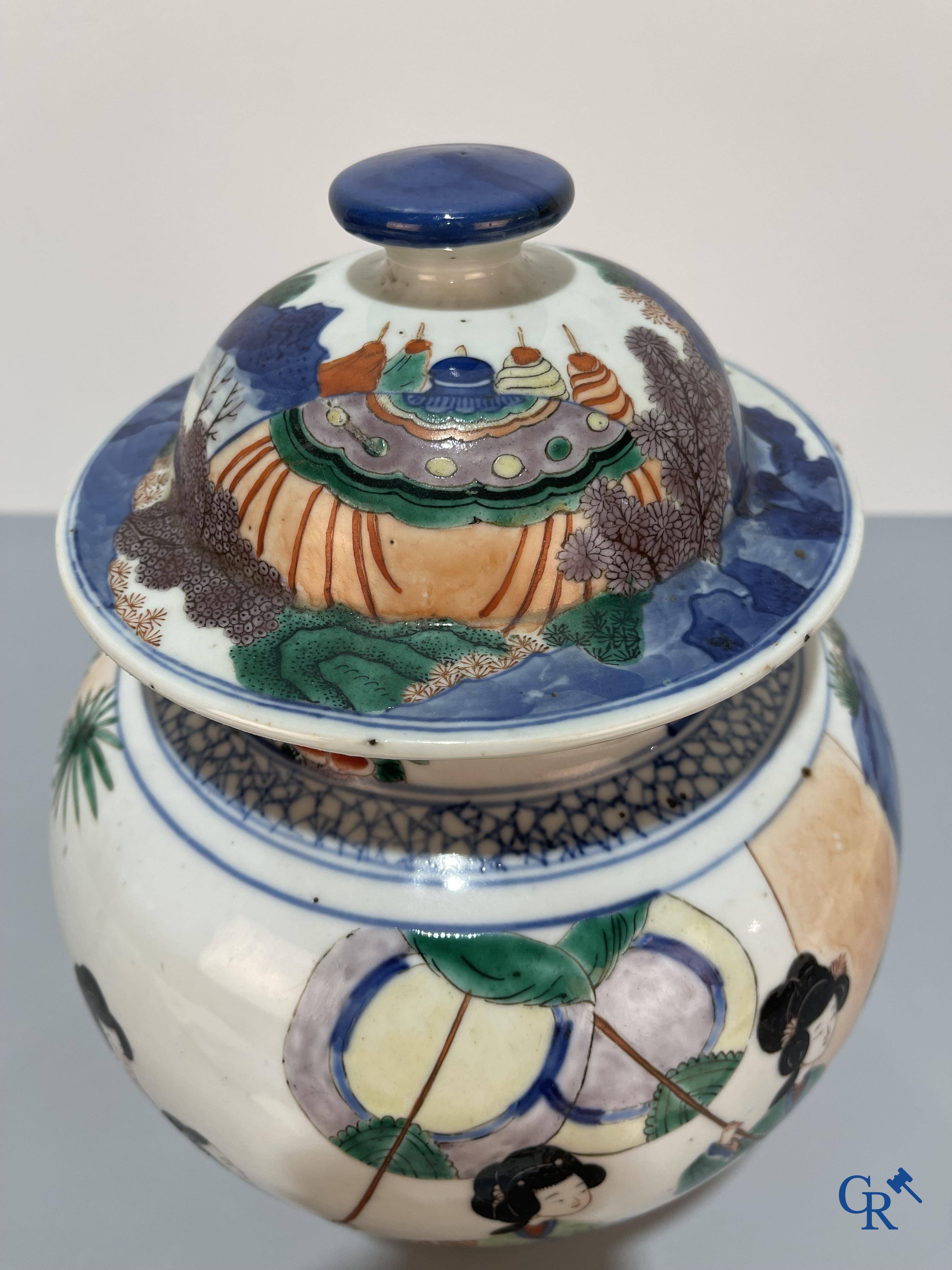 Asian Art, Chinese porcelain, a Chinese Wucai lidded vase with characters.