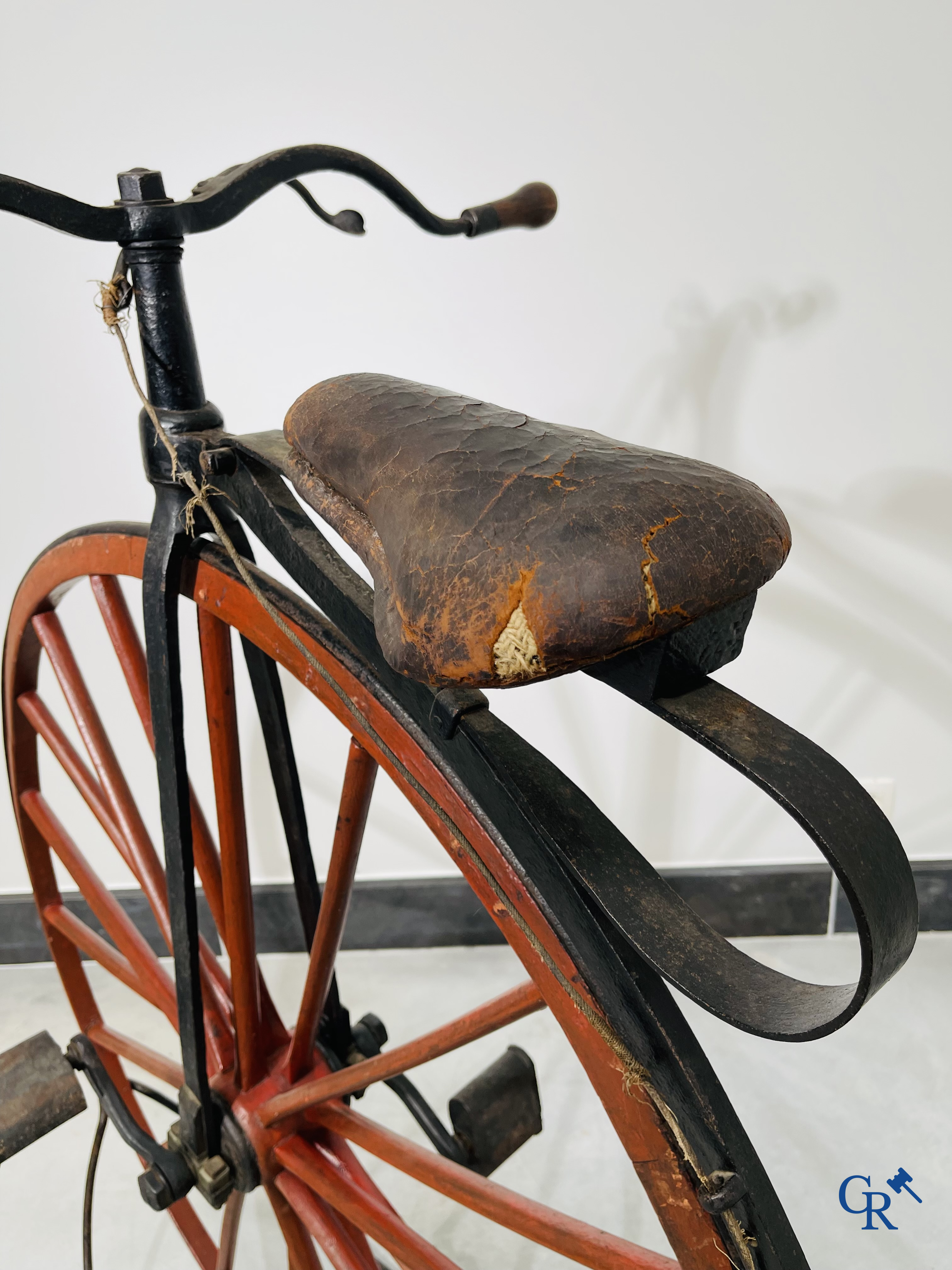 Penny-farthing with wooden spoked wheels on the original wrought iron upright. Circa 1880.