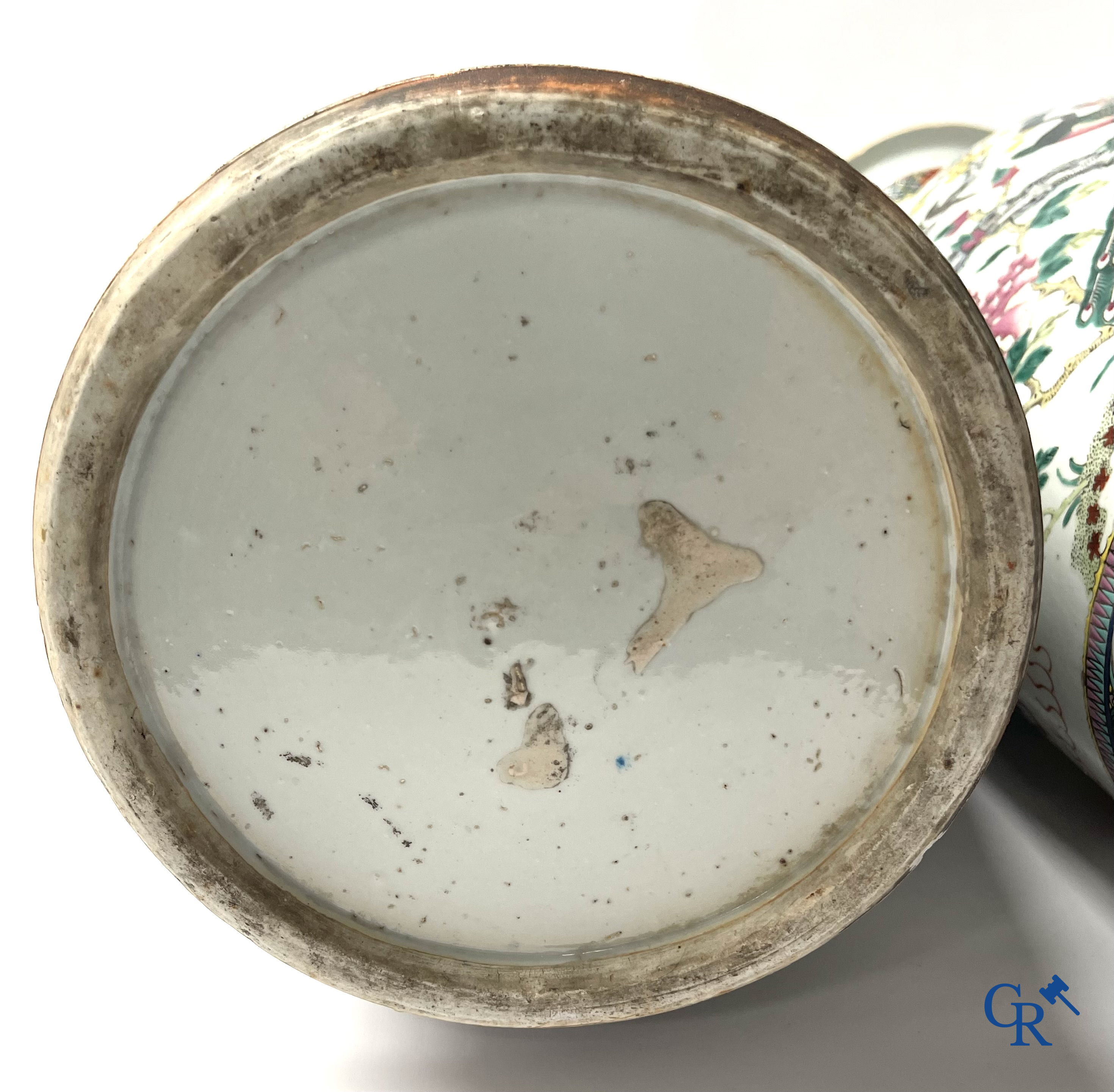 Asian Art, A pair of Chinese famille rose vases with peacocks and Fo dogs. 19th century.