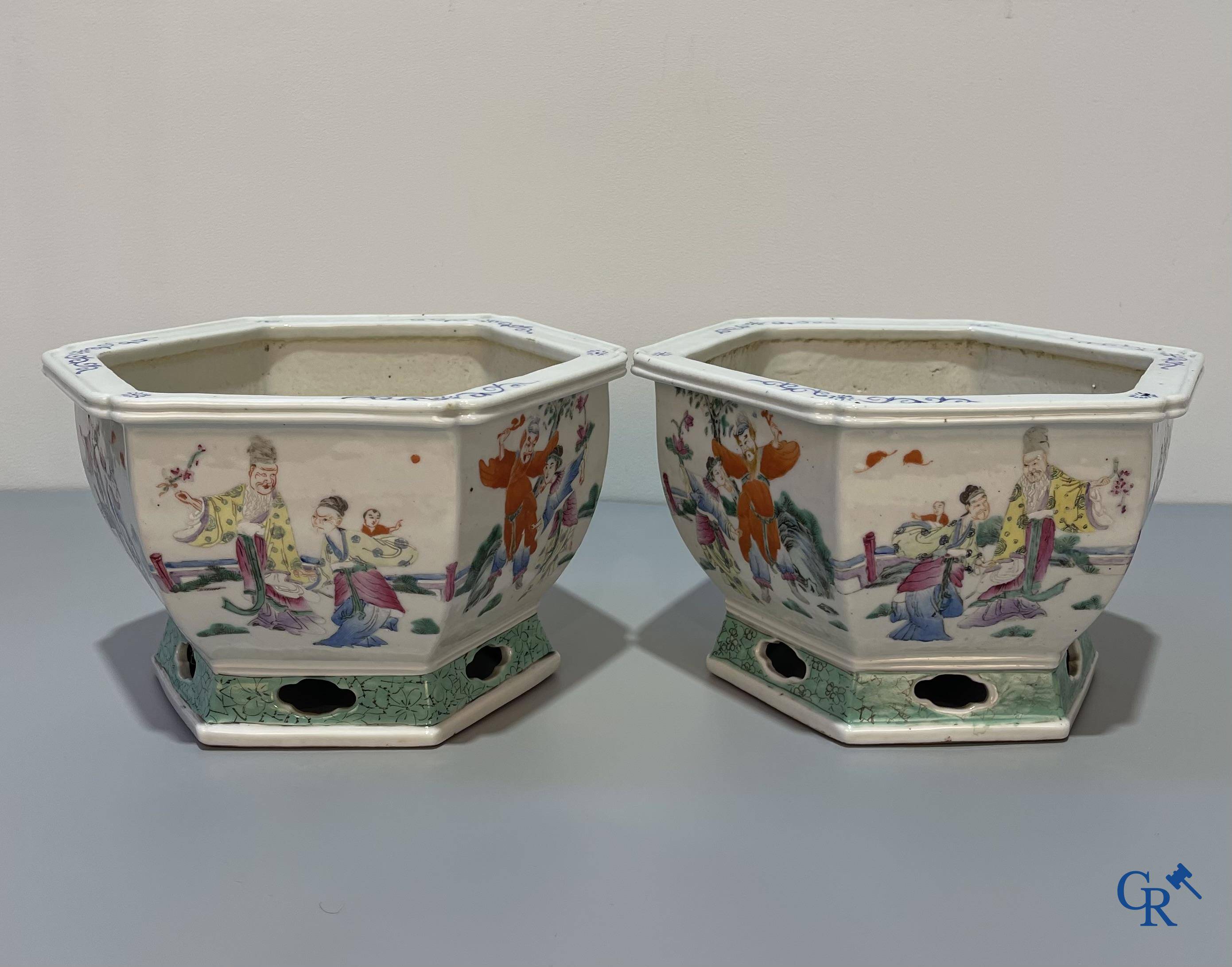 Asian Art, Chinese porcelain, a pair of hexagonal Chinese famille rose jardinieres. 19th century.