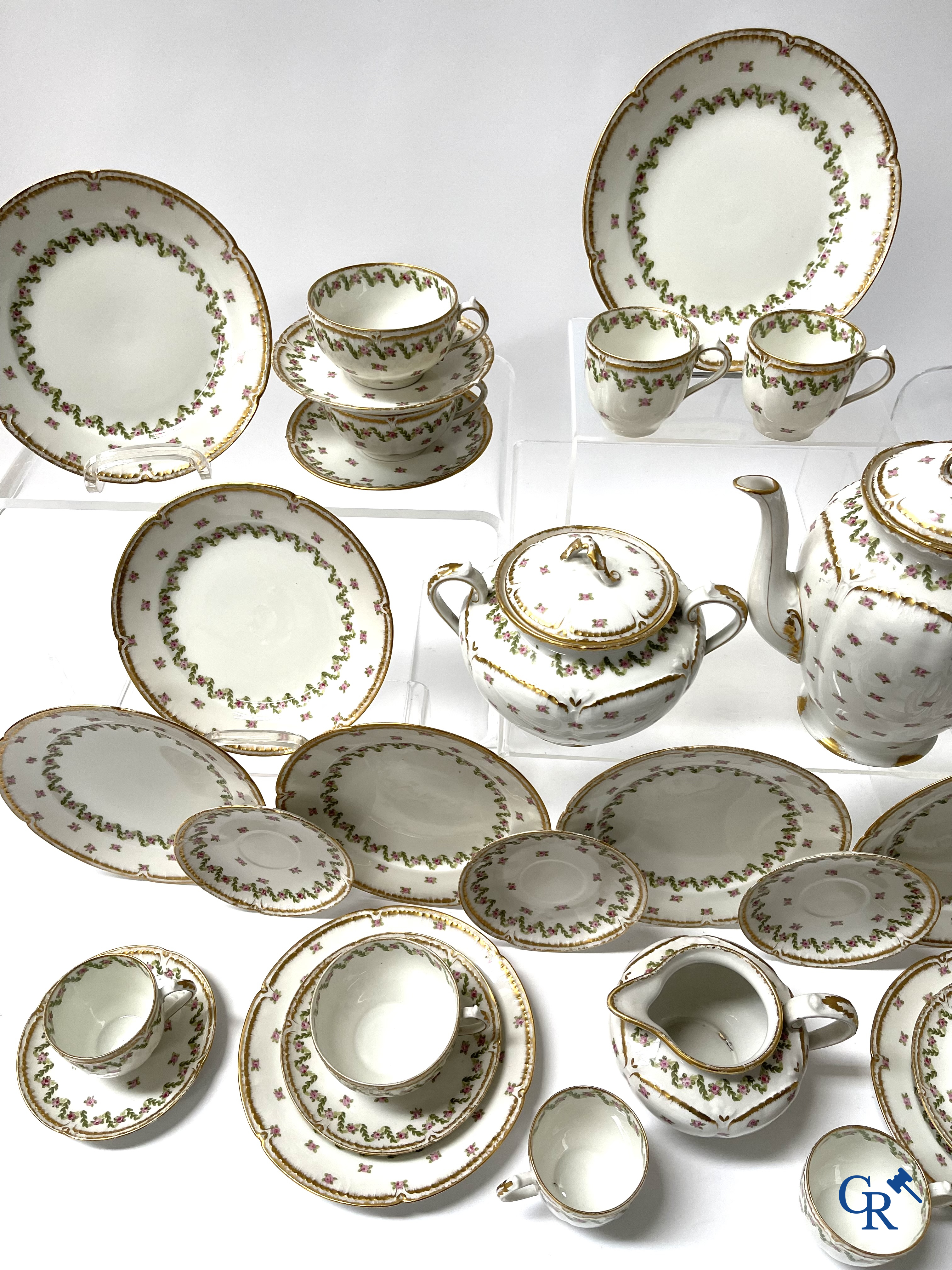 A coffee and tea set with 12 dessert plates in gilded and polychrome decorated French porcelain. Around 1900.