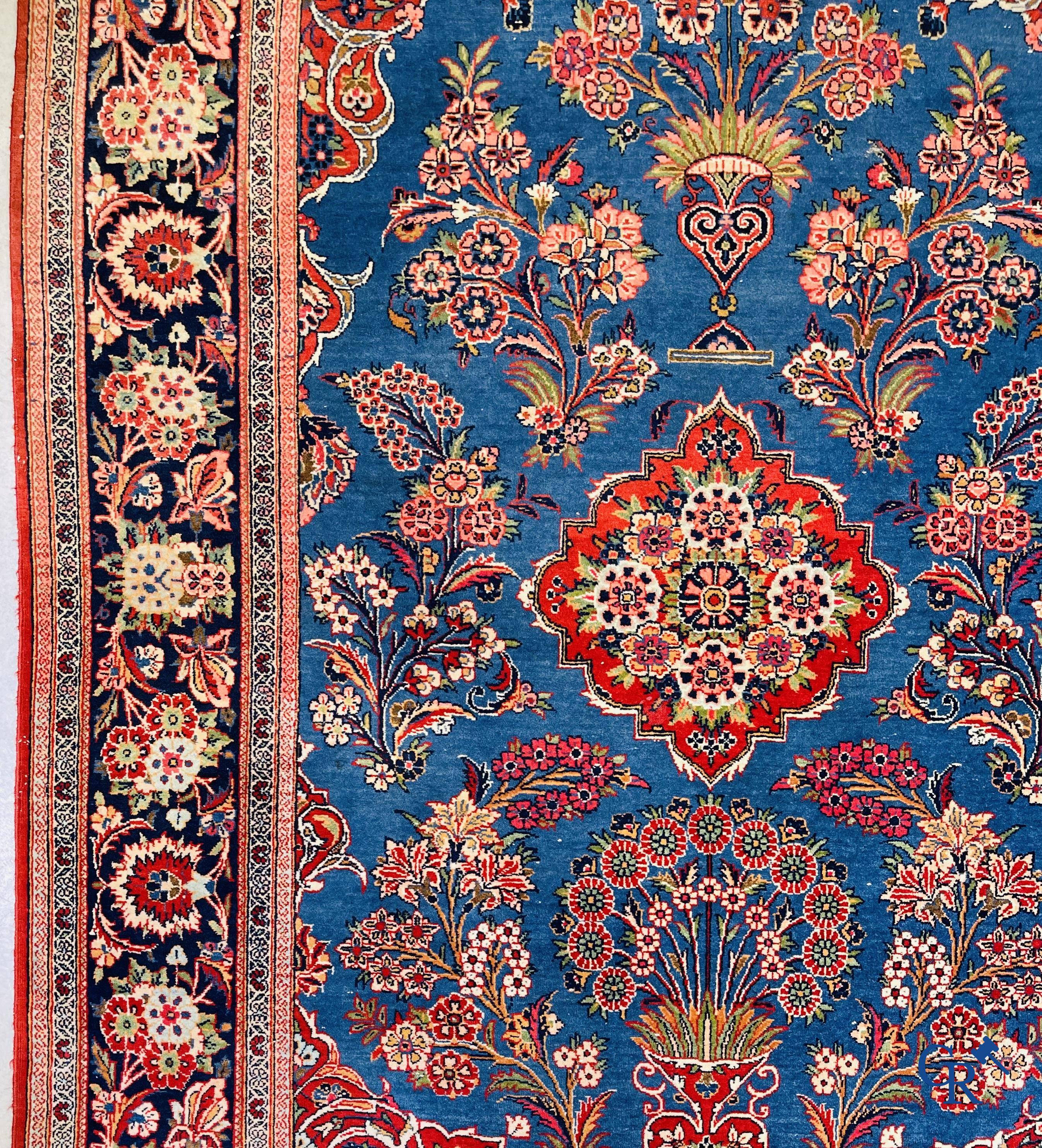Oriental carpets: Iran, finely hand-knotted antique Persian carpet with flowers and flower vases.