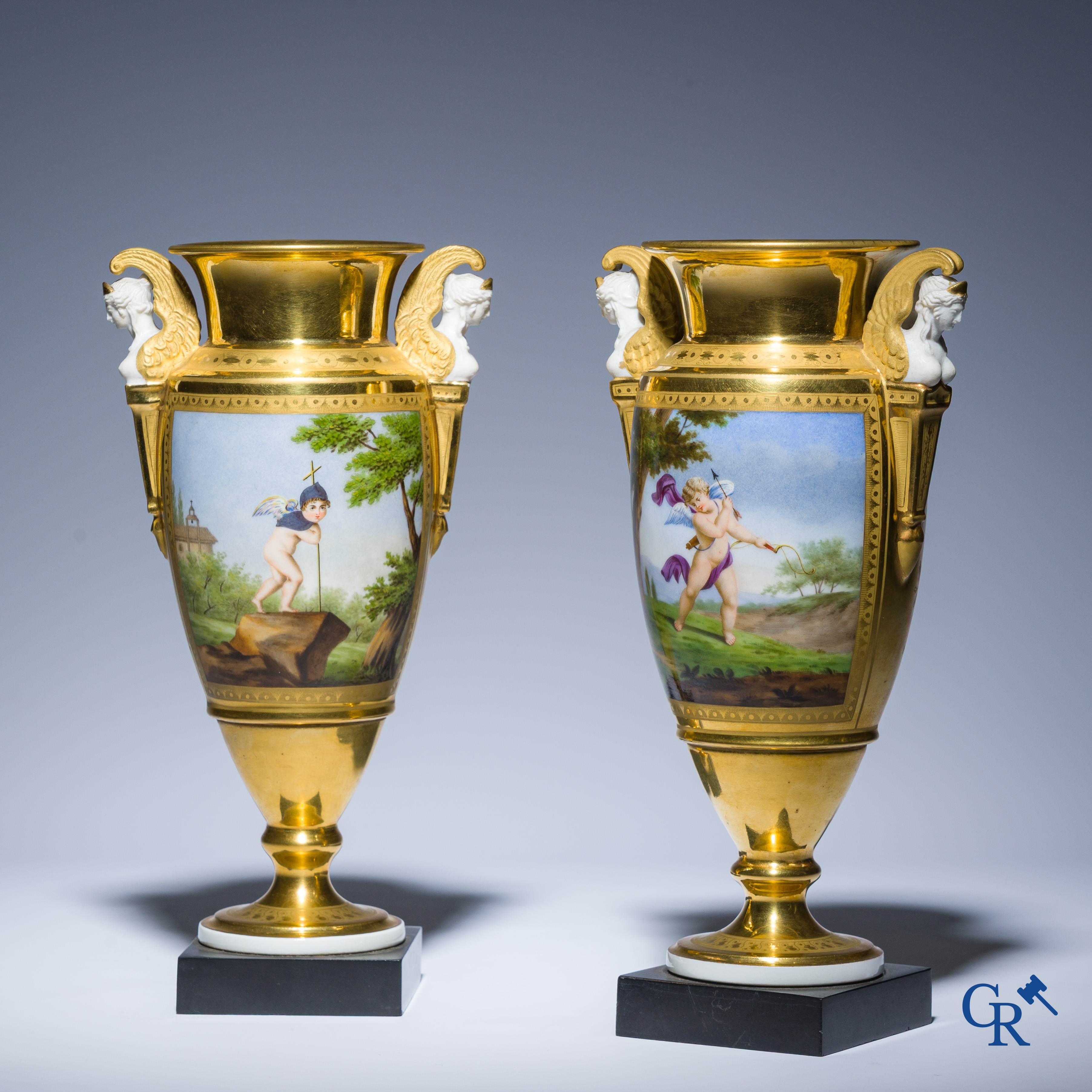 Empire, a pair of finely gilded and decorated vases in porcelain and biscuit on a marble pedestal, Circa 1810.