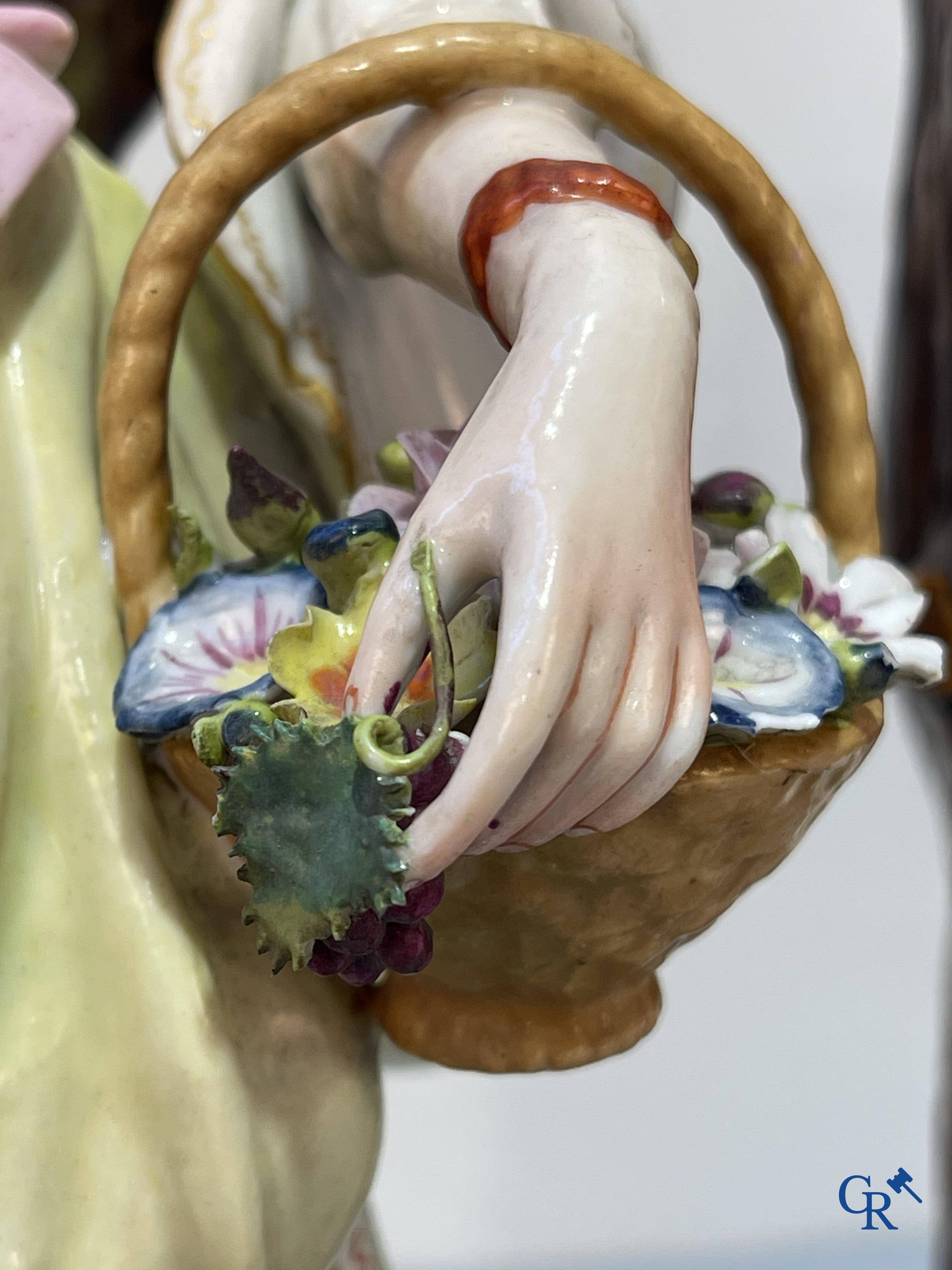 European porcelain, Meissen, a couple in finely polychromed German porcelain. Marked with the swords.