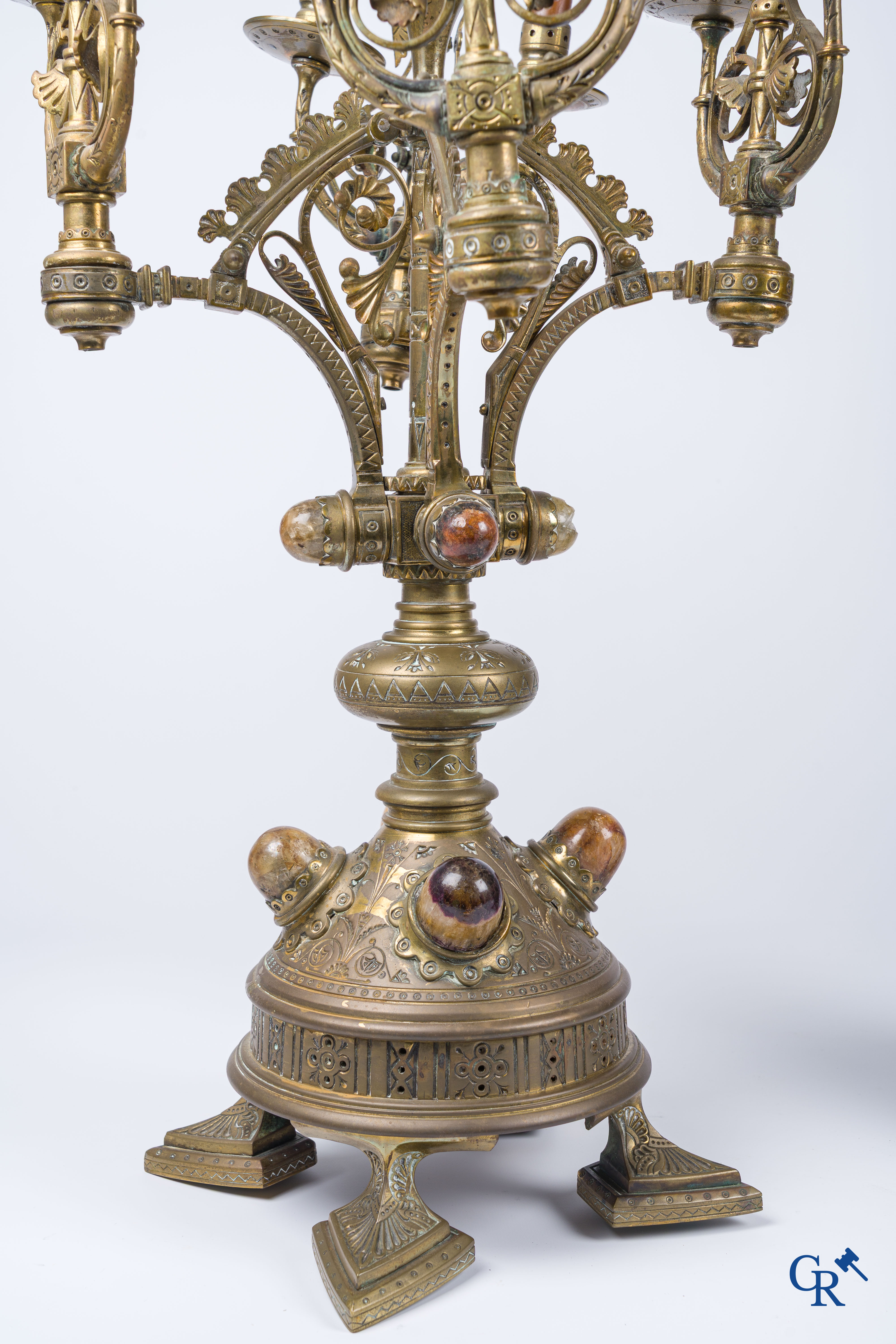 A pair of important bronze candlesticks decorated with various types of rock including amethyst. 19th century.