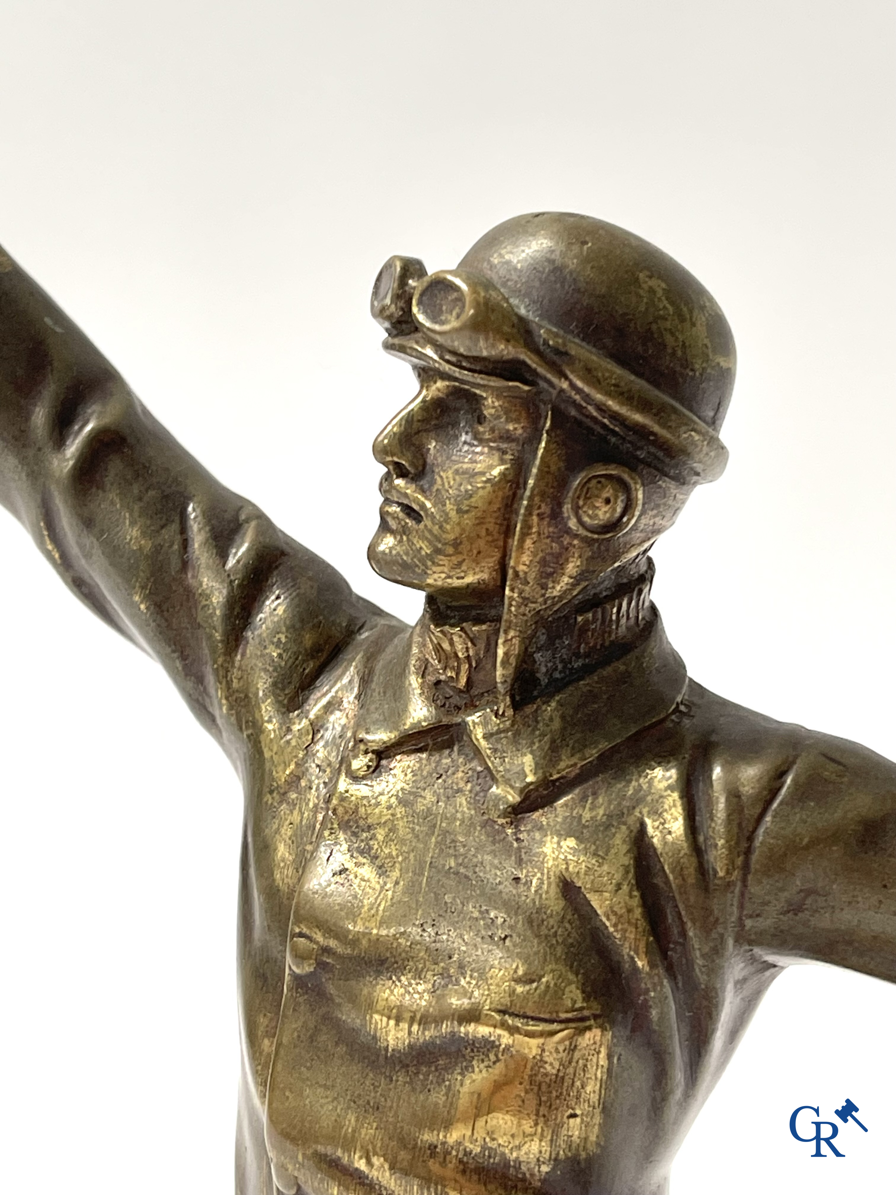 Aeronautics, a bronze representation of an aircraft pilot with propeller. Around 1930.