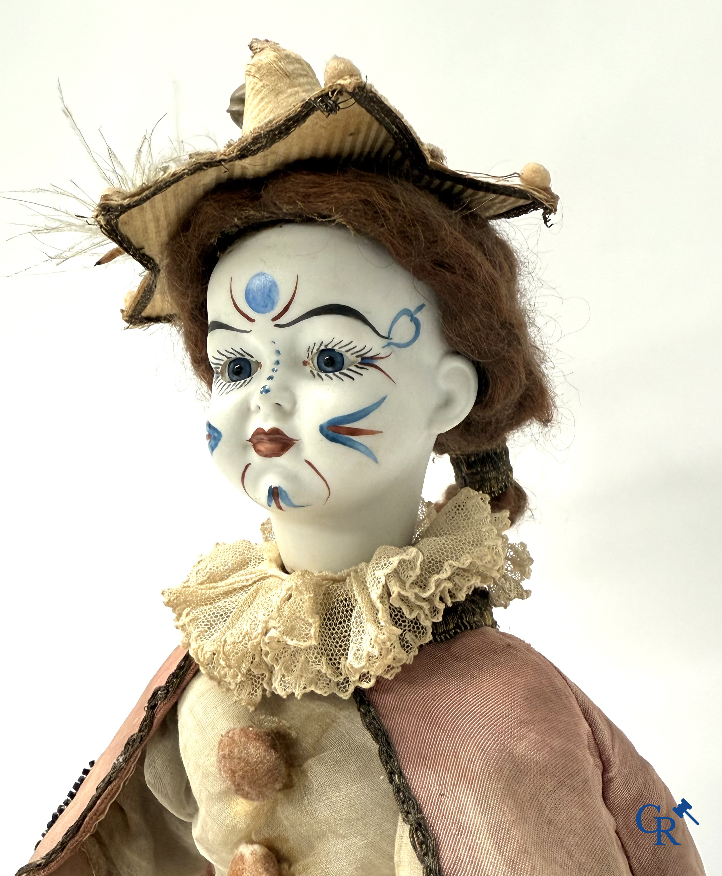 Lambert, Automaat. Clown met bewegingsmechanisme, muziek en porselein hoofd. Circa 1900.