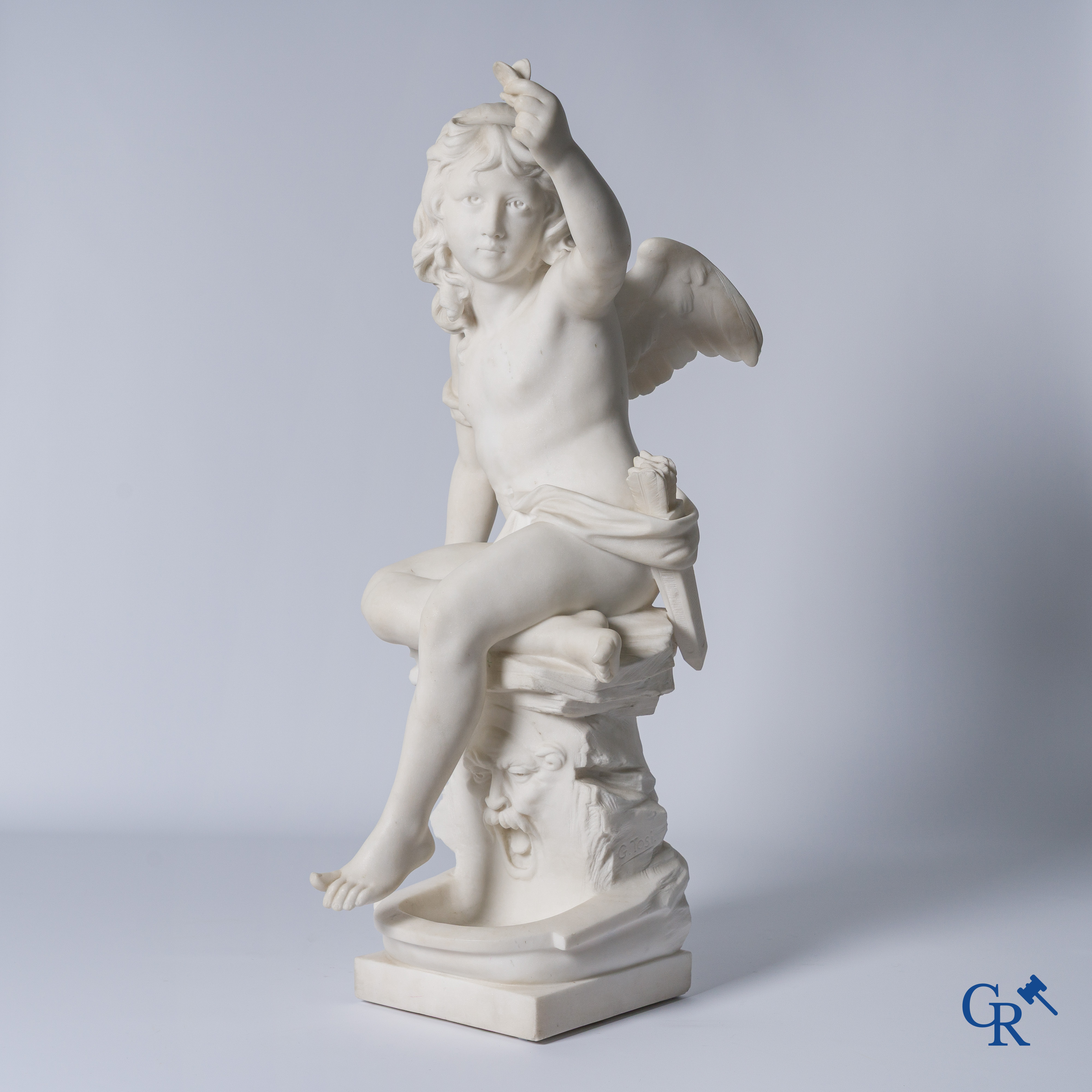 G. Tosi, Beautiful statue in carved marble, seated cupid at wall fountain. Circa 1900.