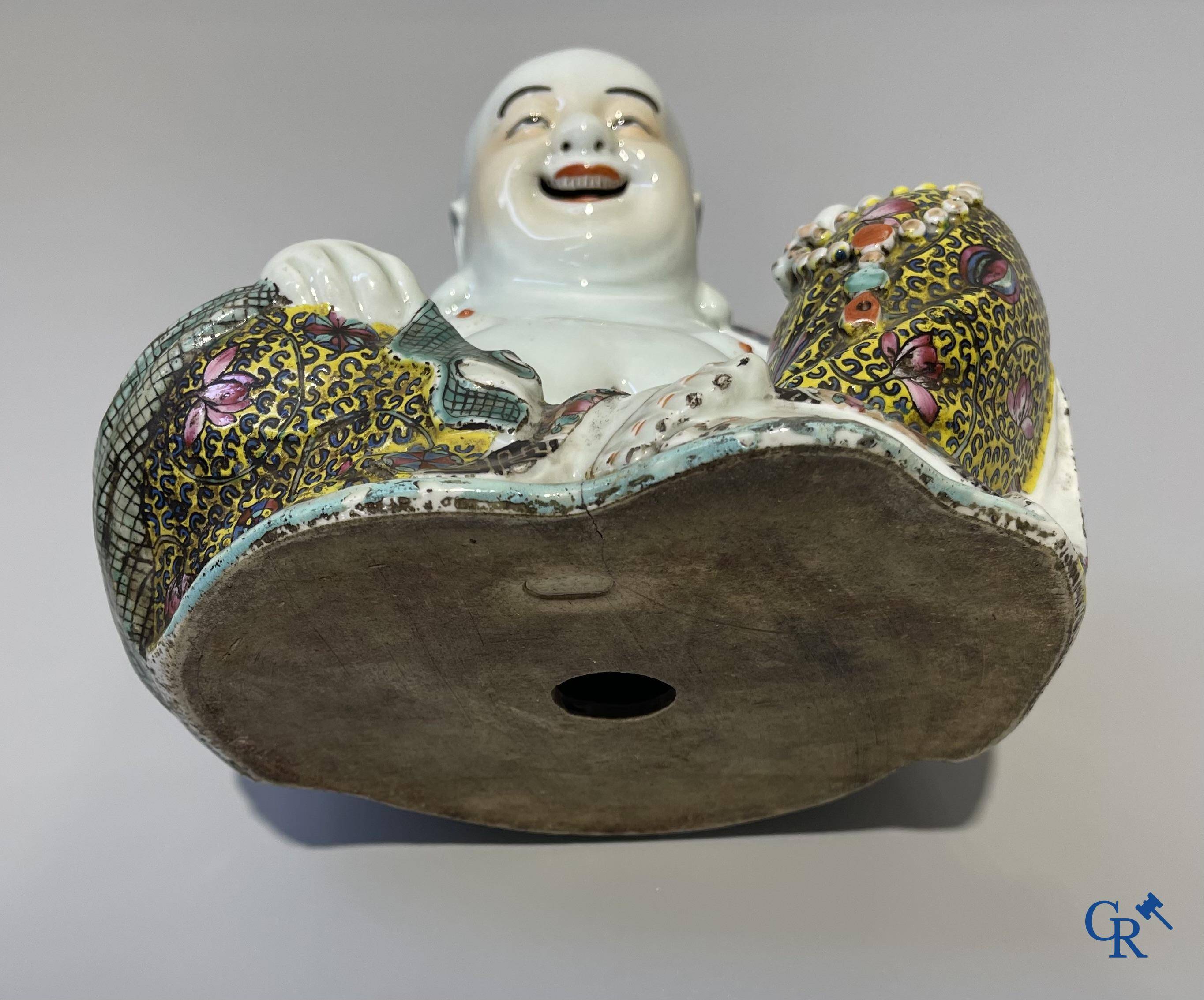 Asian Art, Chinese porcelain. A Chinese famille rose figure of a Buddha with a seal mark. 19th century.
