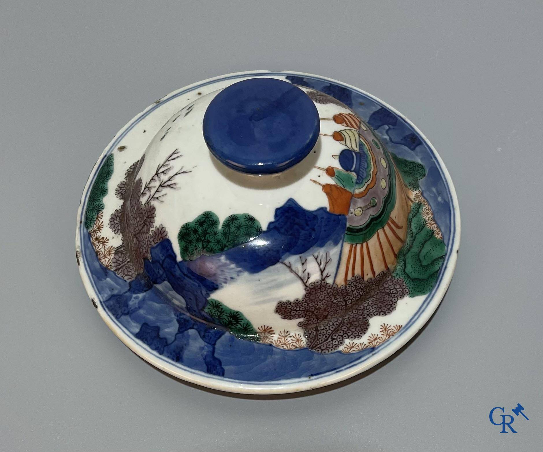 Asian Art, Chinese porcelain, a Chinese Wucai lidded vase with characters.