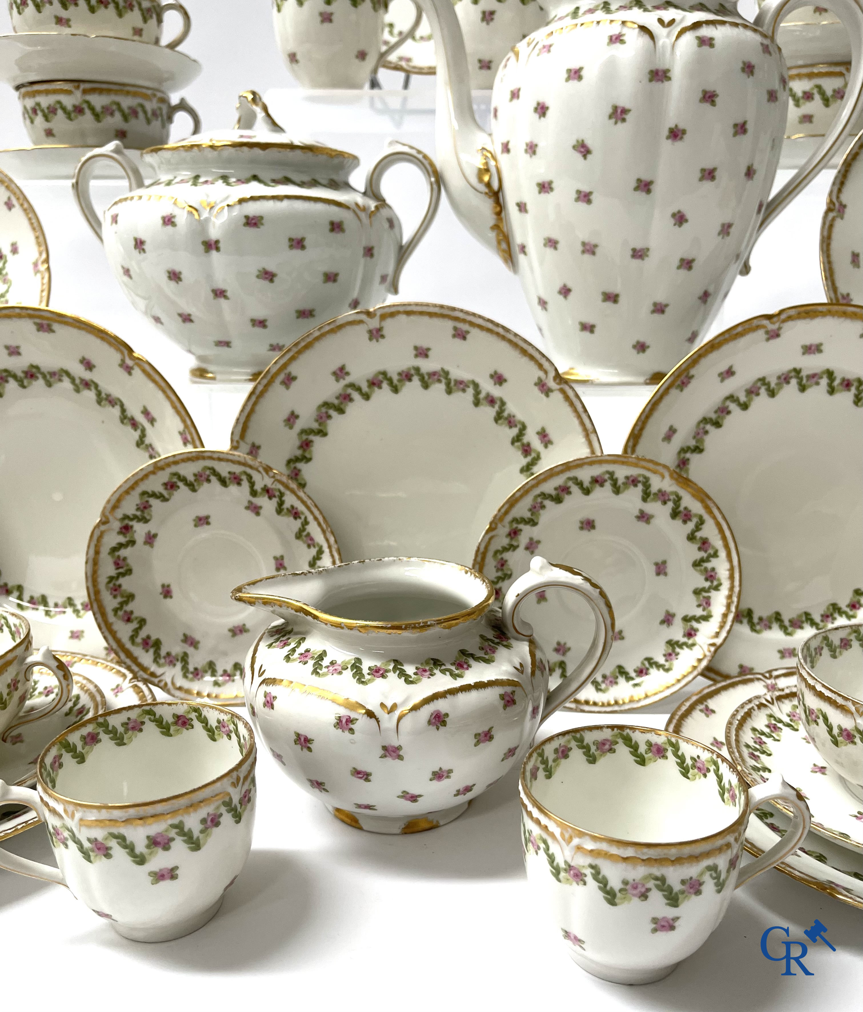 A coffee and tea set with 12 dessert plates in gilded and polychrome decorated French porcelain. Around 1900.