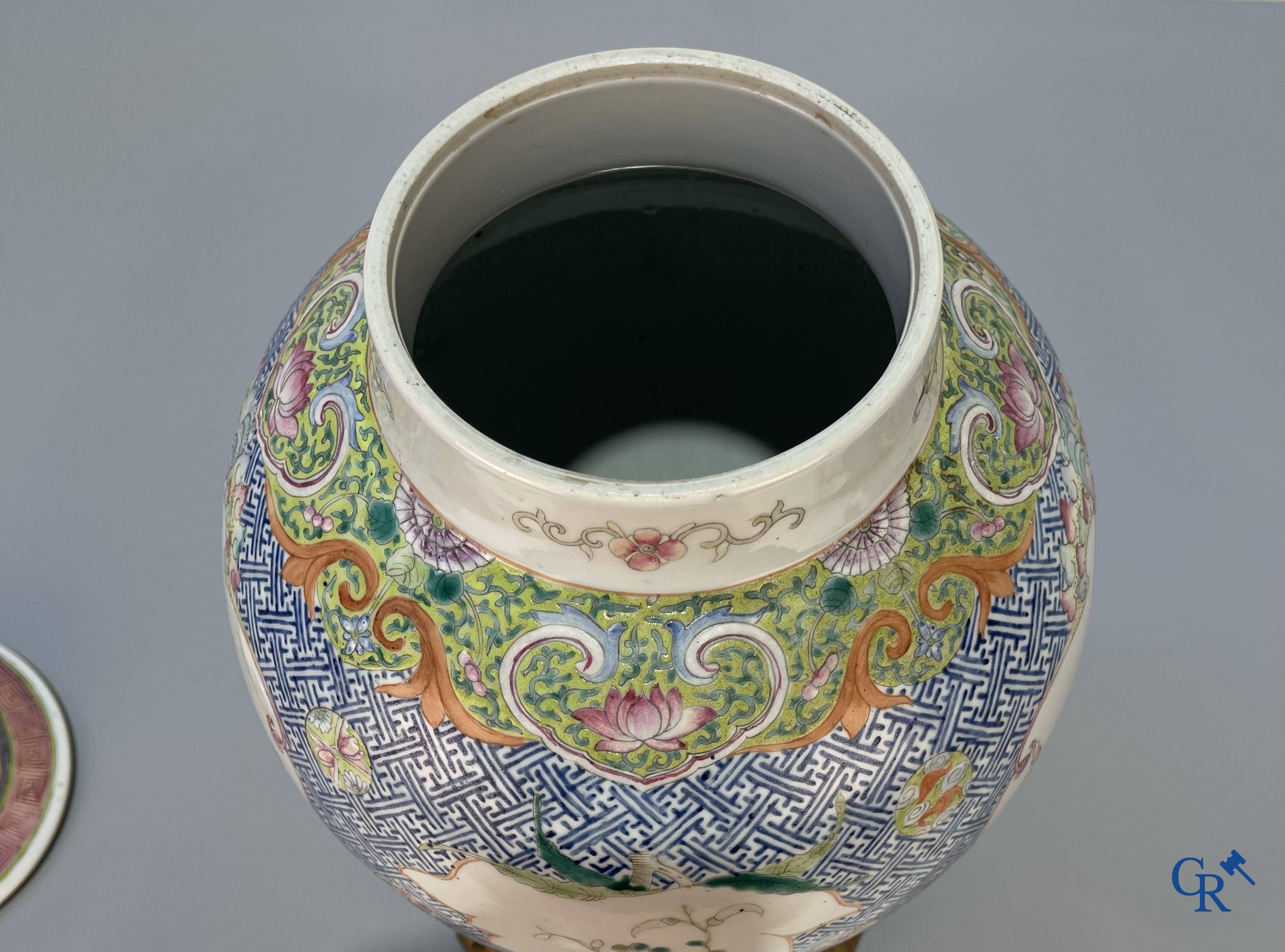 Asian Art, Chinese porcelain, a finely decorated Chinese famille rose vase with bronze. 19th century.