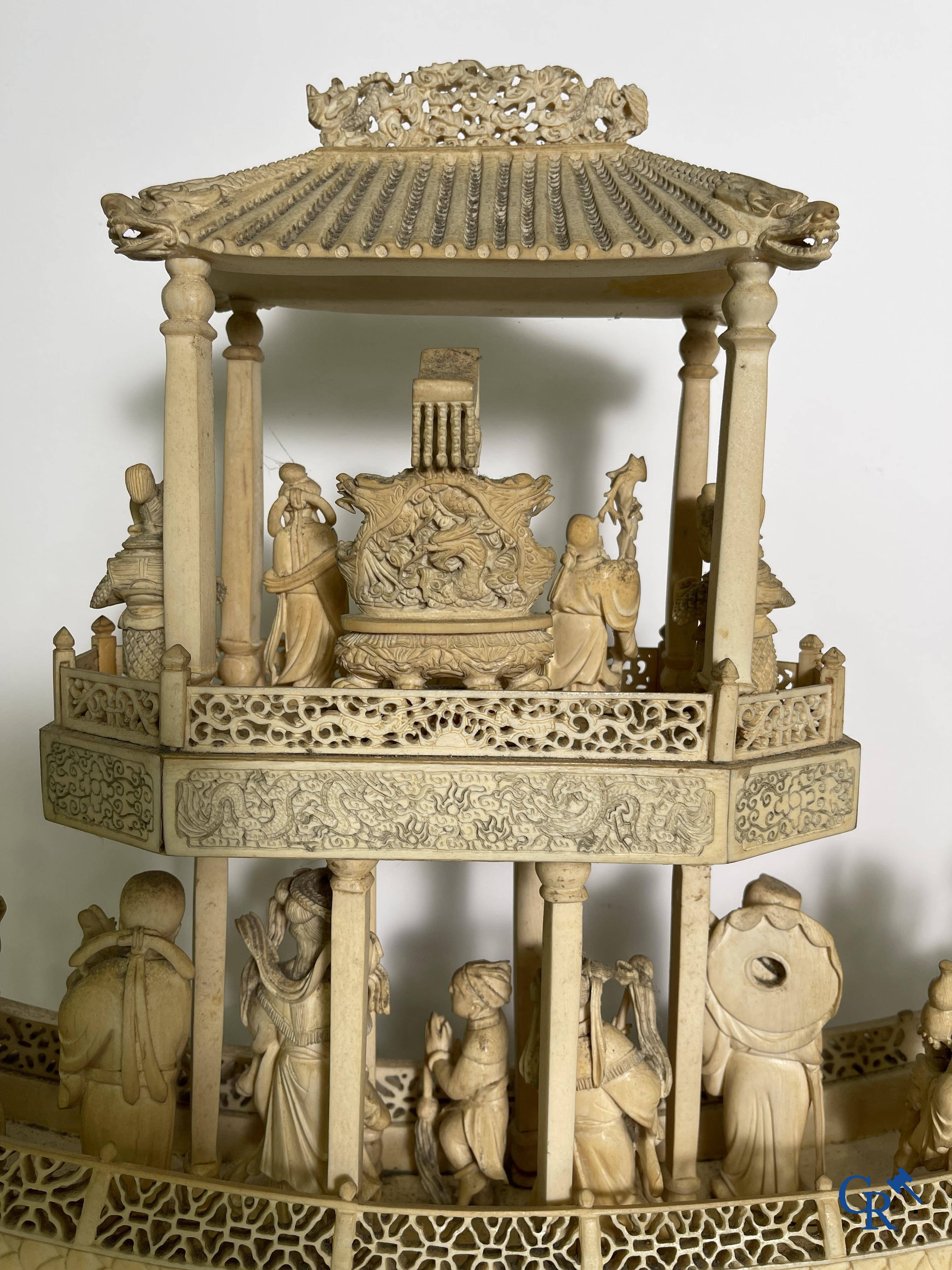 Asian Art: A large Chinese ivory dragon boat on a wooden pedestal. 19th century.