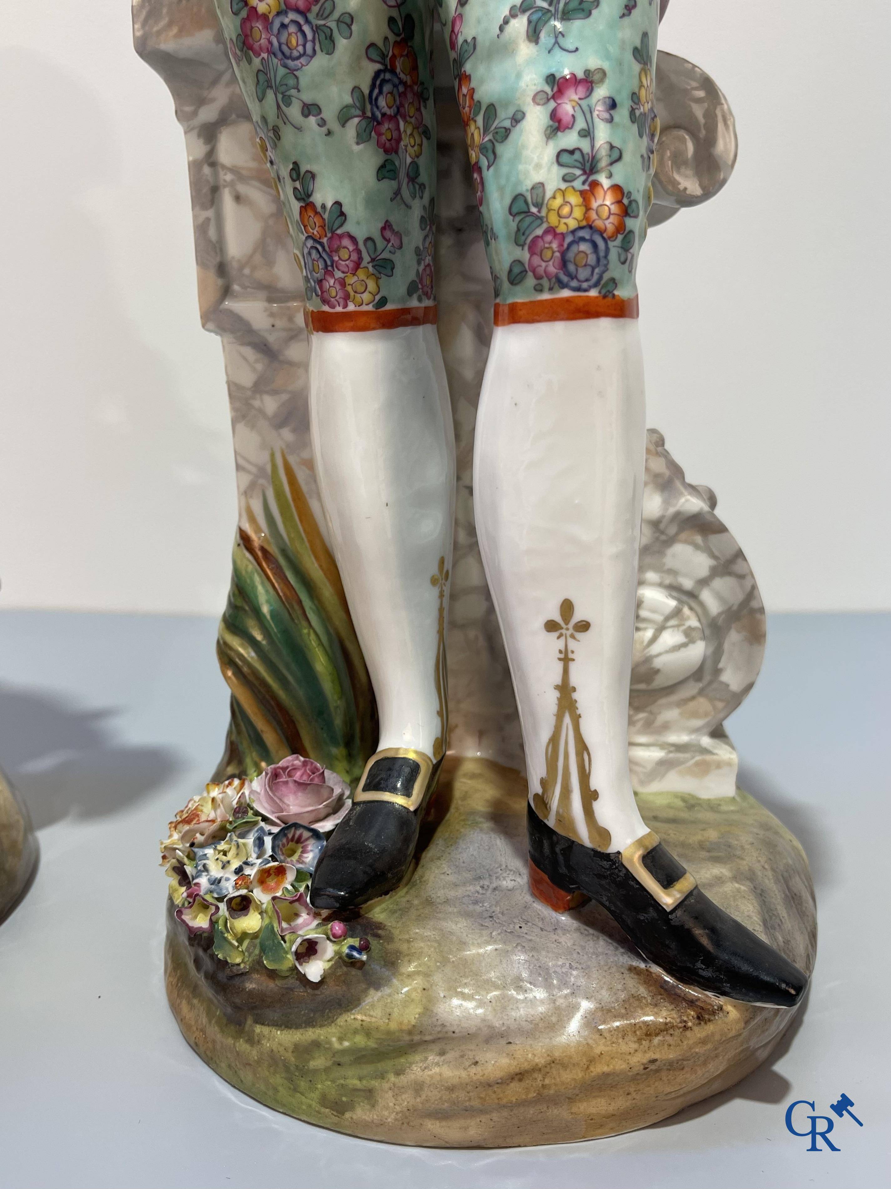 European porcelain, Meissen, a couple in finely polychromed German porcelain. Marked with the swords.